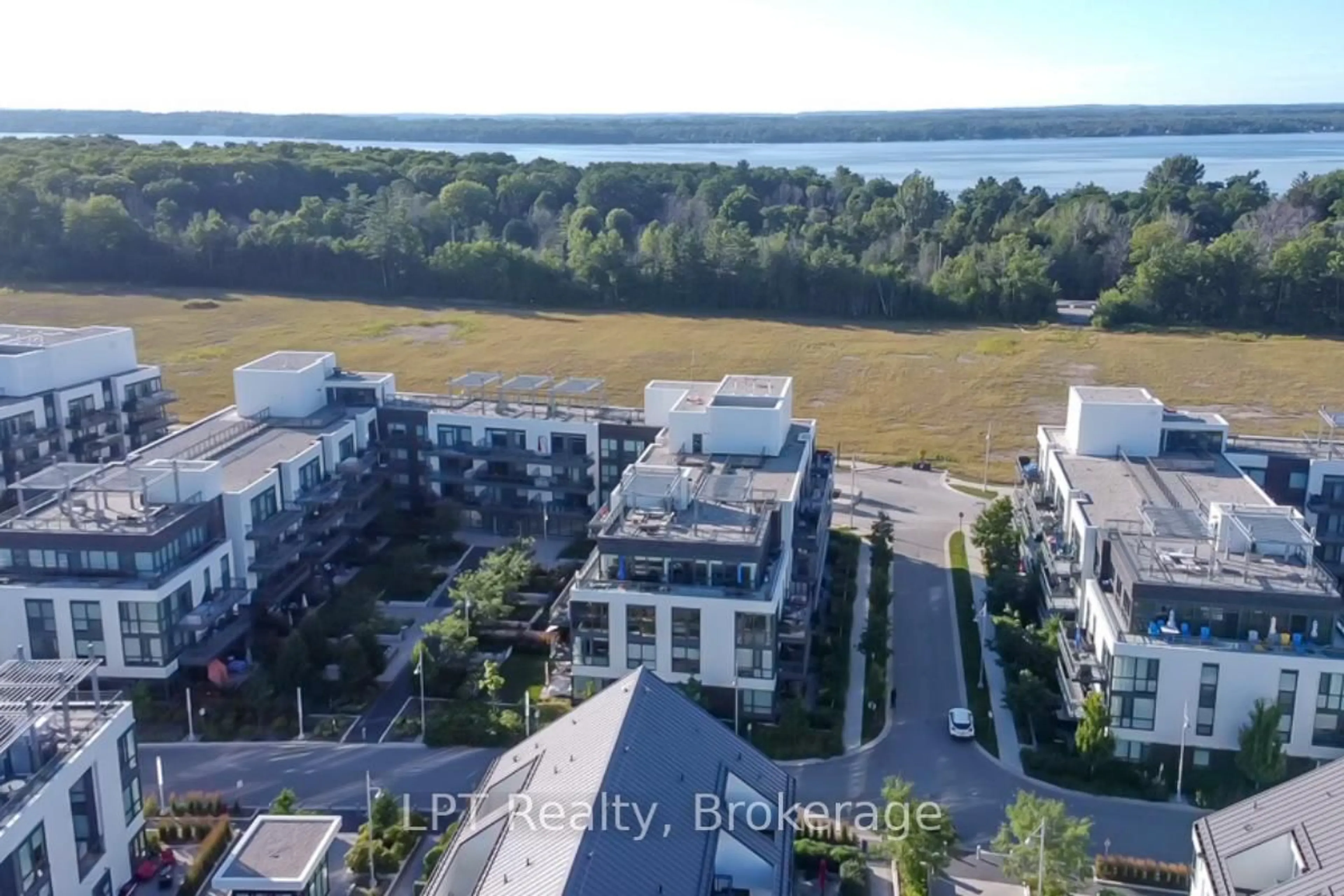 A pic from outside/outdoor area/front of a property/back of a property/a pic from drone, water/lake/river/ocean view for 301 Sea Ray Ave #C319, Innisfil Ontario L9S 0L8