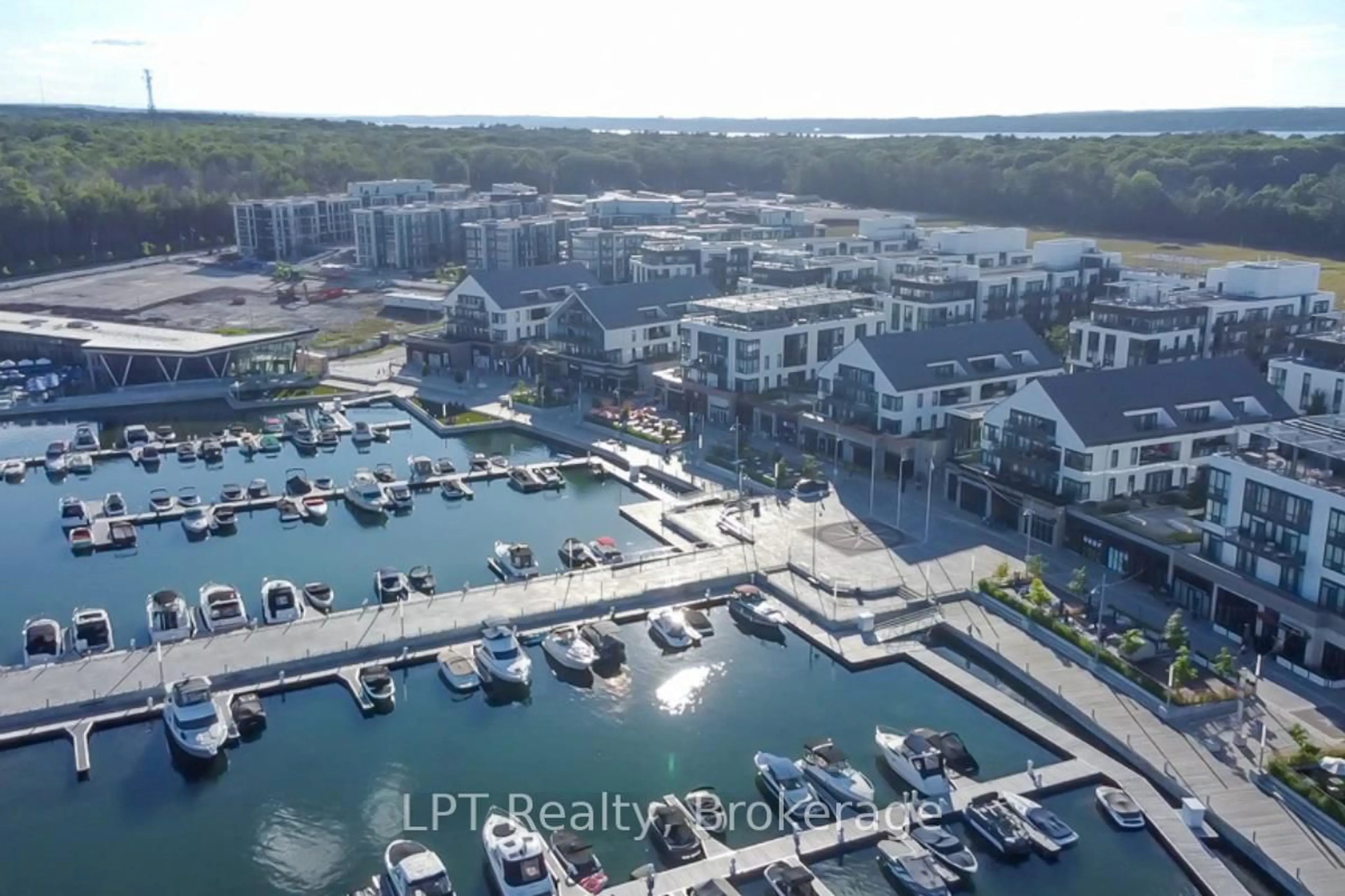 A pic from outside/outdoor area/front of a property/back of a property/a pic from drone, water/lake/river/ocean view for 301 Sea Ray Ave #C319, Innisfil Ontario L9S 0L8