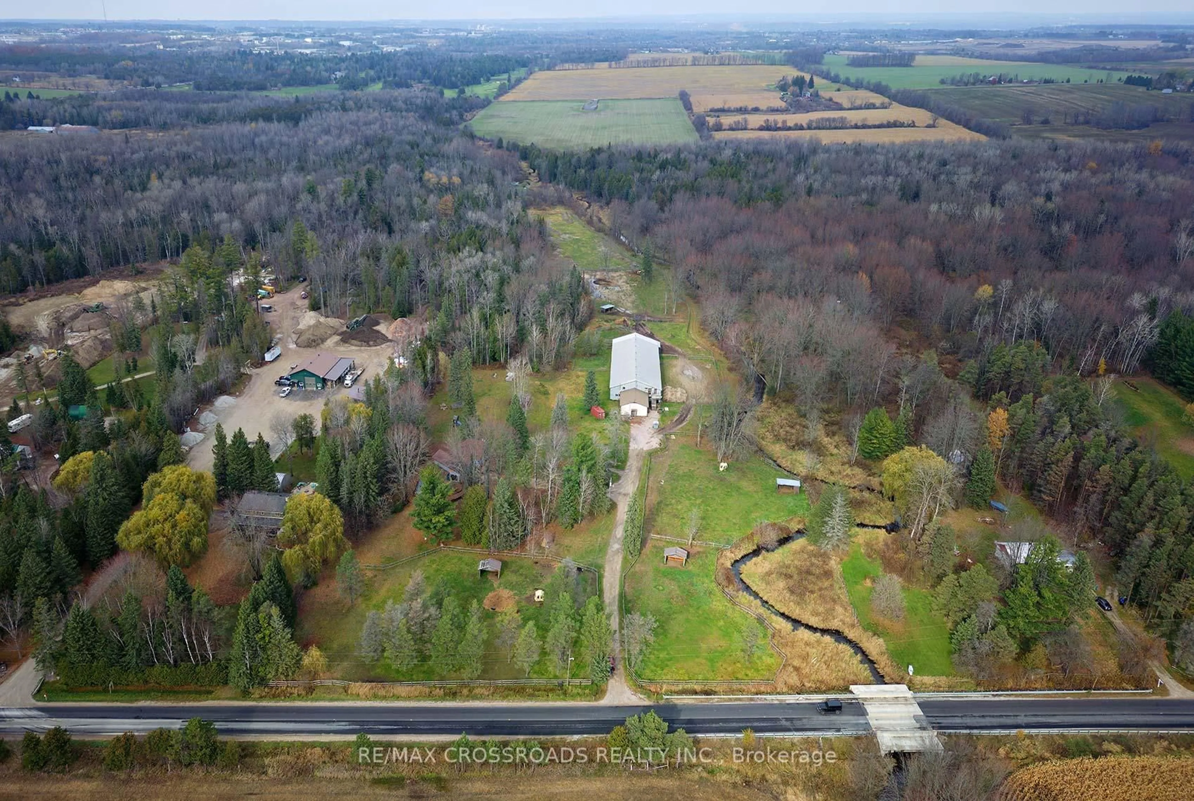 A pic from outside/outdoor area/front of a property/back of a property/a pic from drone, forest/trees view for 2726 9th Line, Innisfil Ontario L9S 3Z8