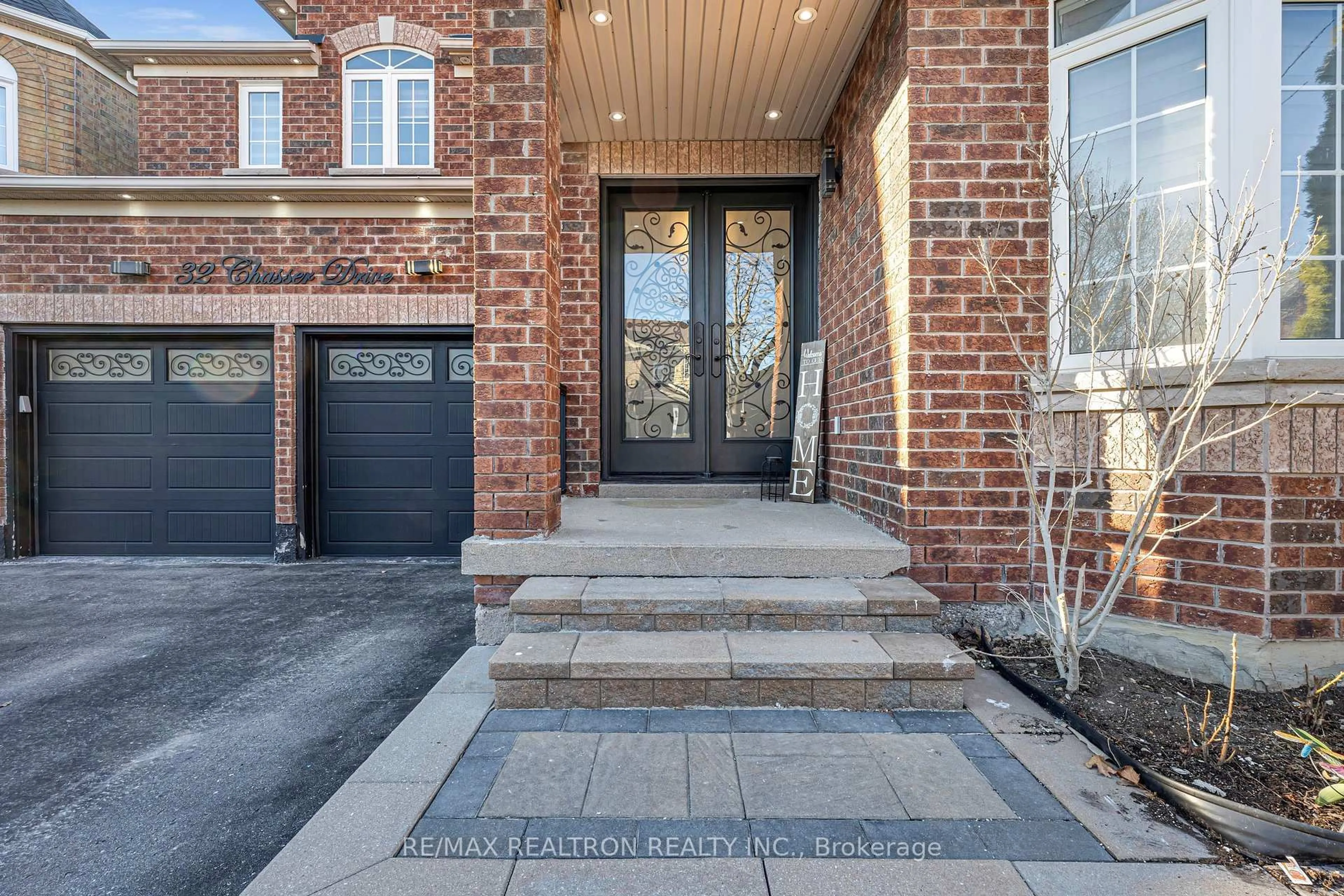 Home with brick exterior material, street for 32 Chasser Dr, Markham Ontario L6E 1S6
