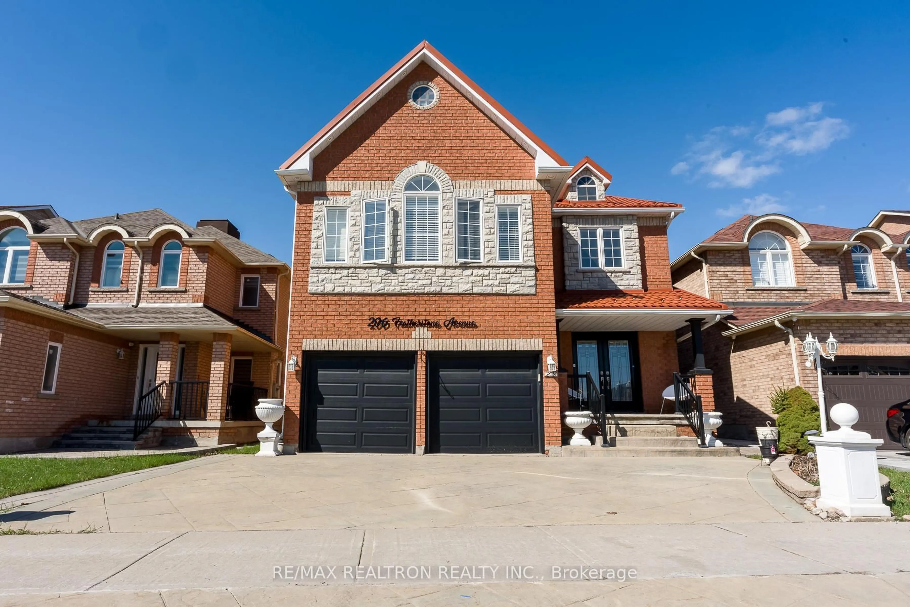 Home with brick exterior material, street for 206 Featherstone Ave, Markham Ontario L3S 4J1