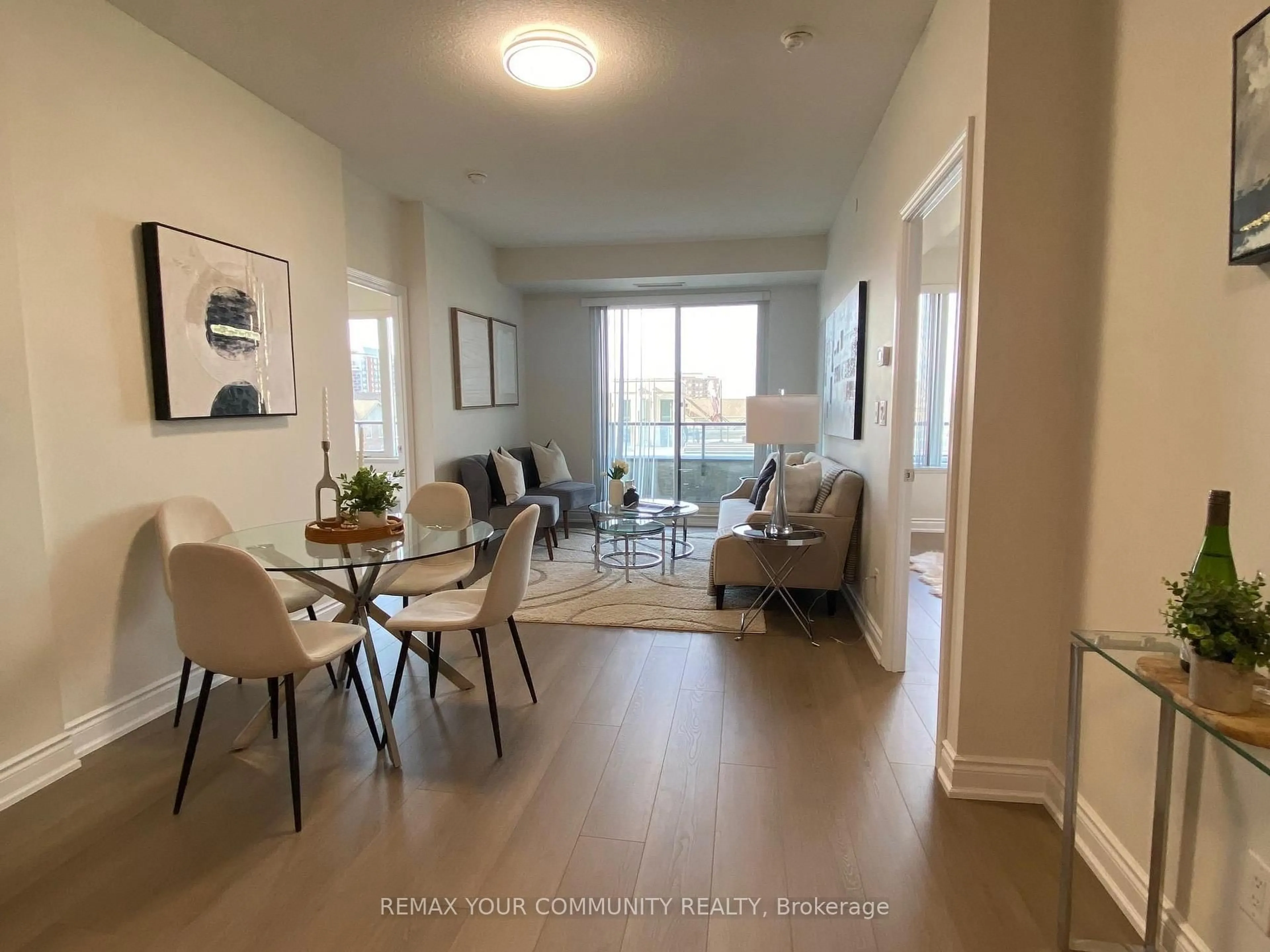 Living room with furniture, wood/laminate floor for 325 South Park Rd #517, Markham Ontario L3T 0B8