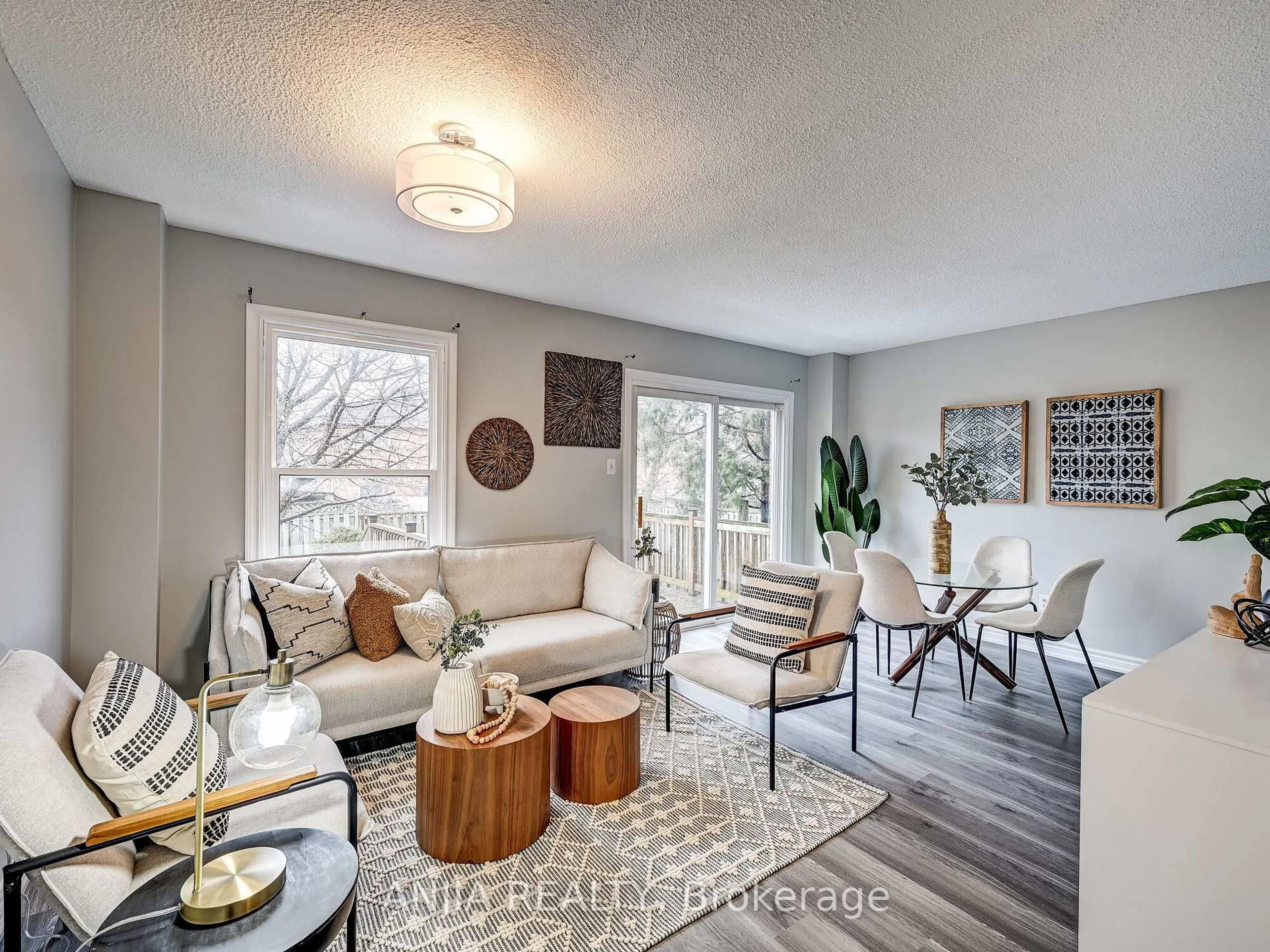 Living room with furniture, wood/laminate floor for 61 Sorrell Cres, Markham Ontario L3S 1K9