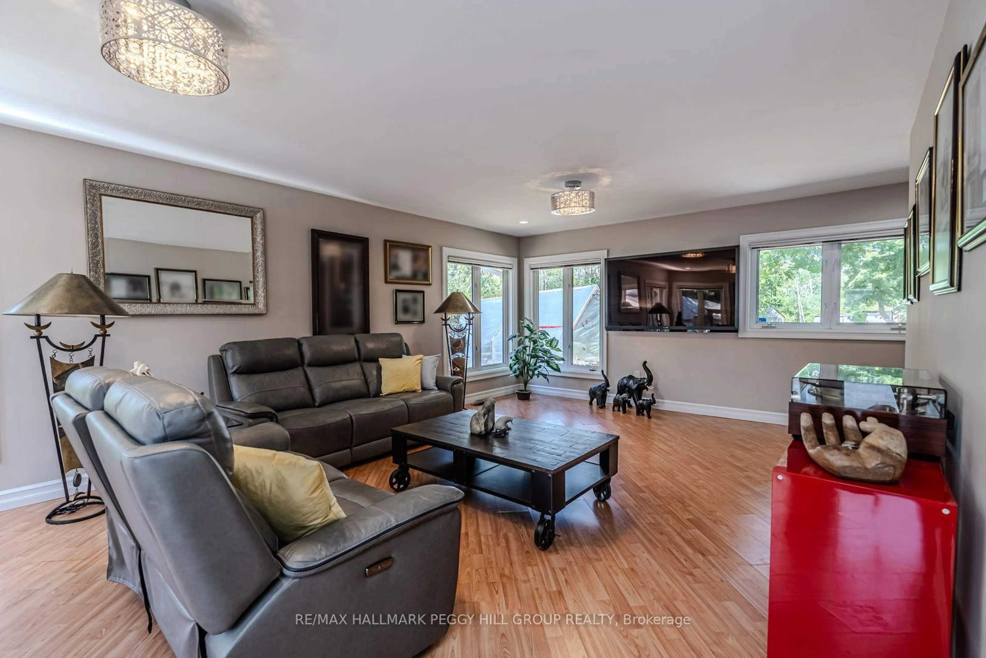 Living room with furniture, wood/laminate floor for 2582 Leonard St, Innisfil Ontario L9S 3T9