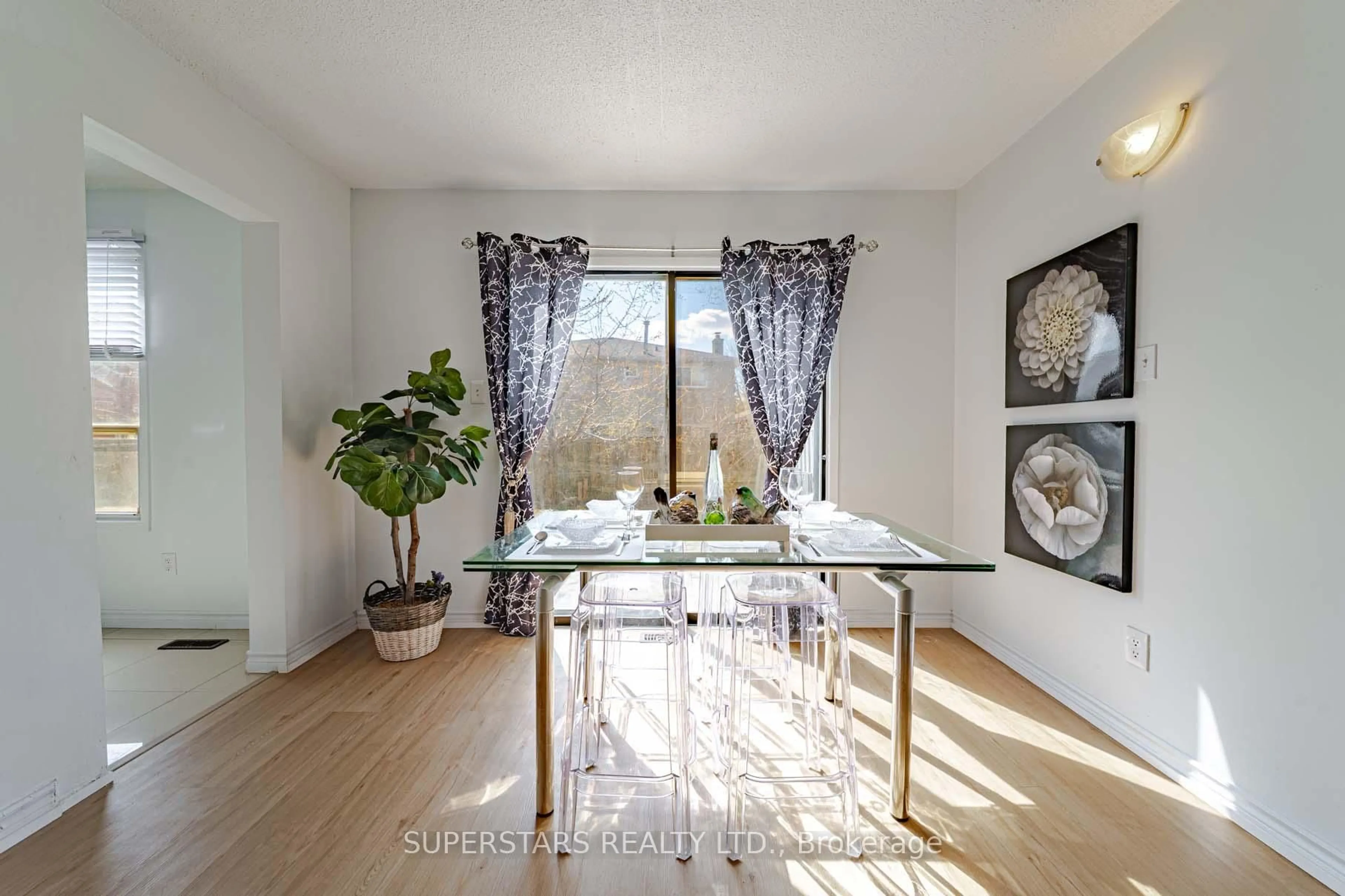 Dining room, wood/laminate floor for 135 Appleby Cres, Markham Ontario L3R 4L1