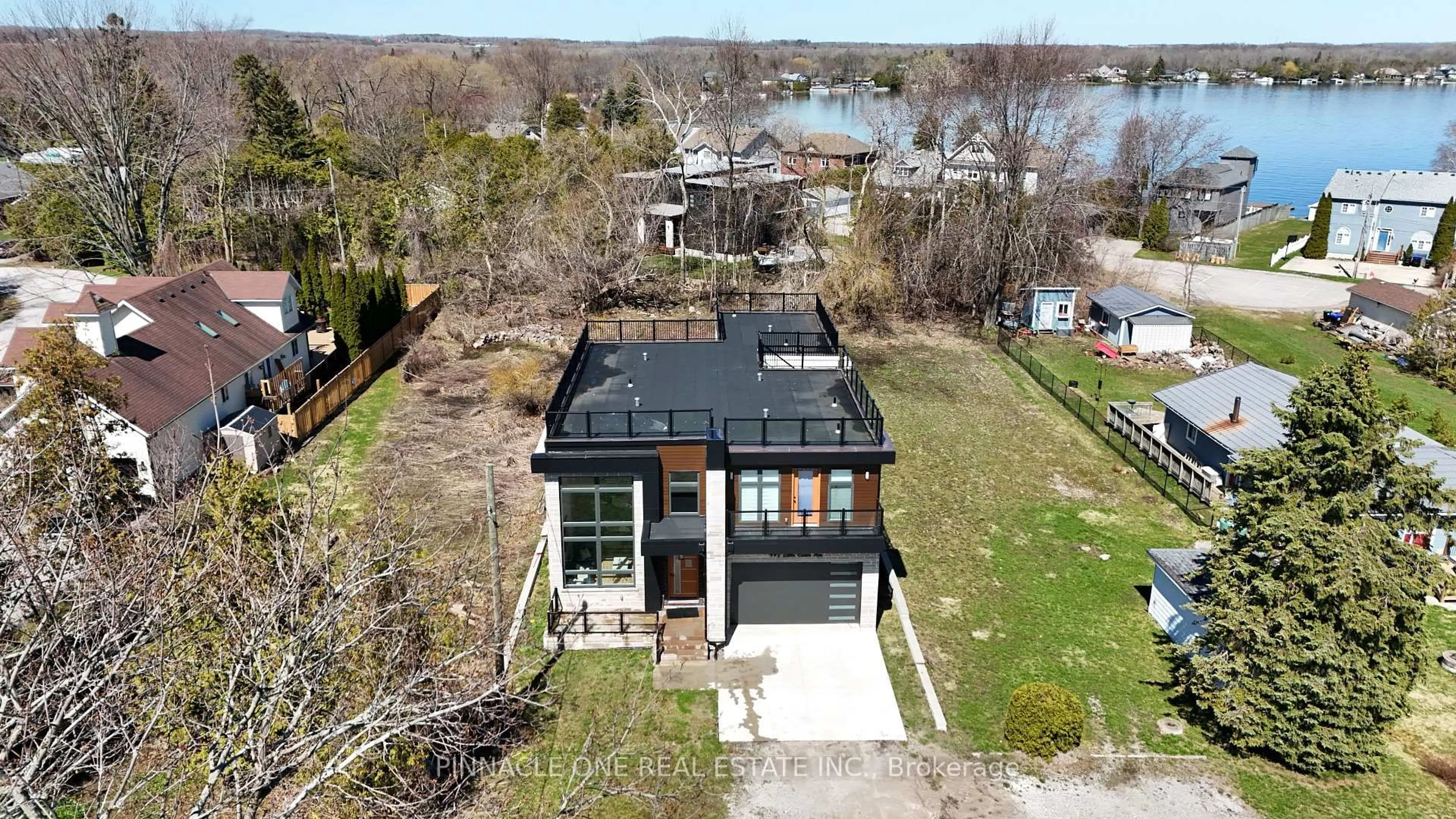 A pic from outside/outdoor area/front of a property/back of a property/a pic from drone, water/lake/river/ocean view for 992 Little Cedar Ave, Innisfil Ontario L0L 1W0