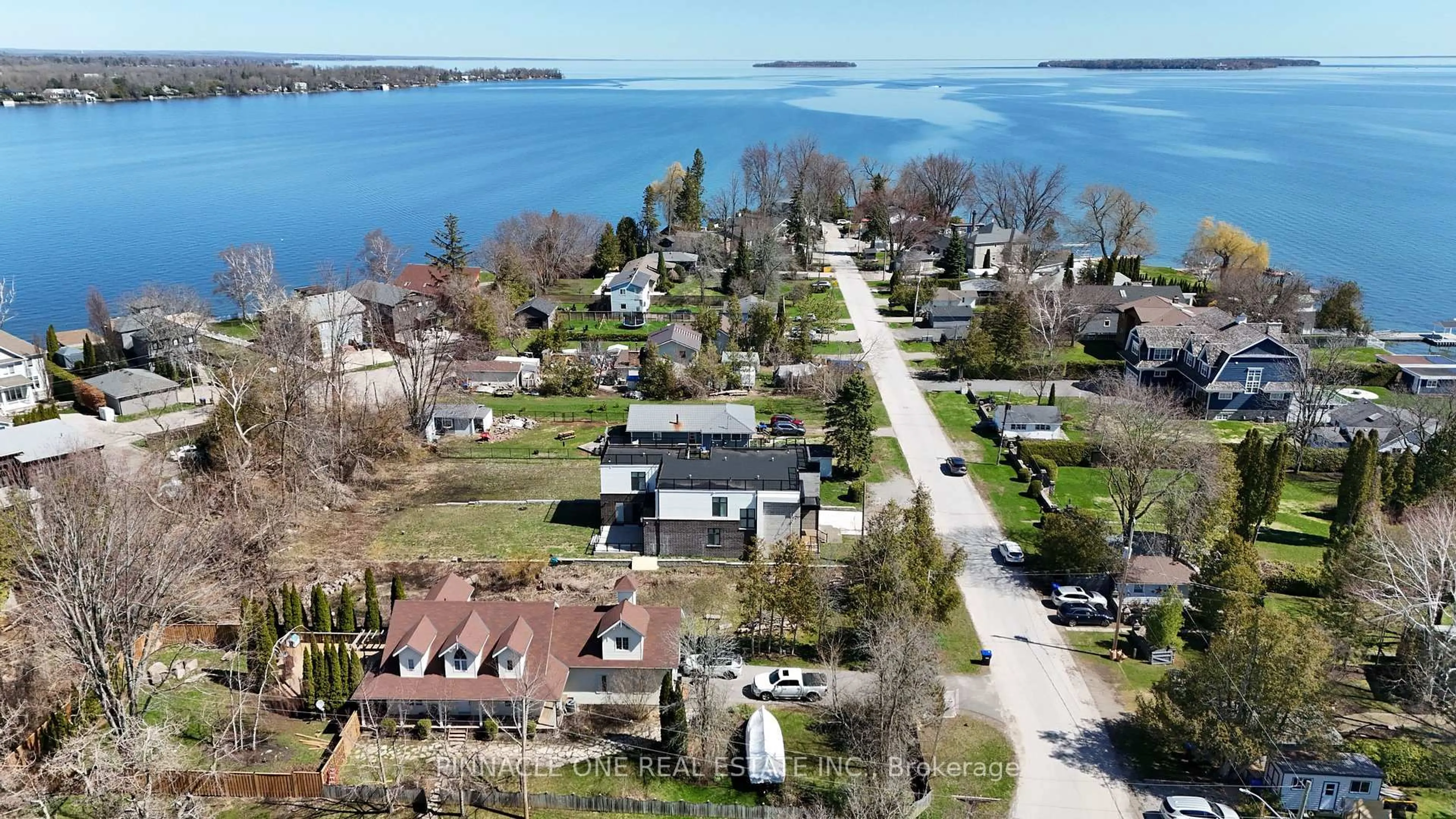 A pic from outside/outdoor area/front of a property/back of a property/a pic from drone, water/lake/river/ocean view for 992 Little Cedar Ave, Innisfil Ontario L0L 1W0