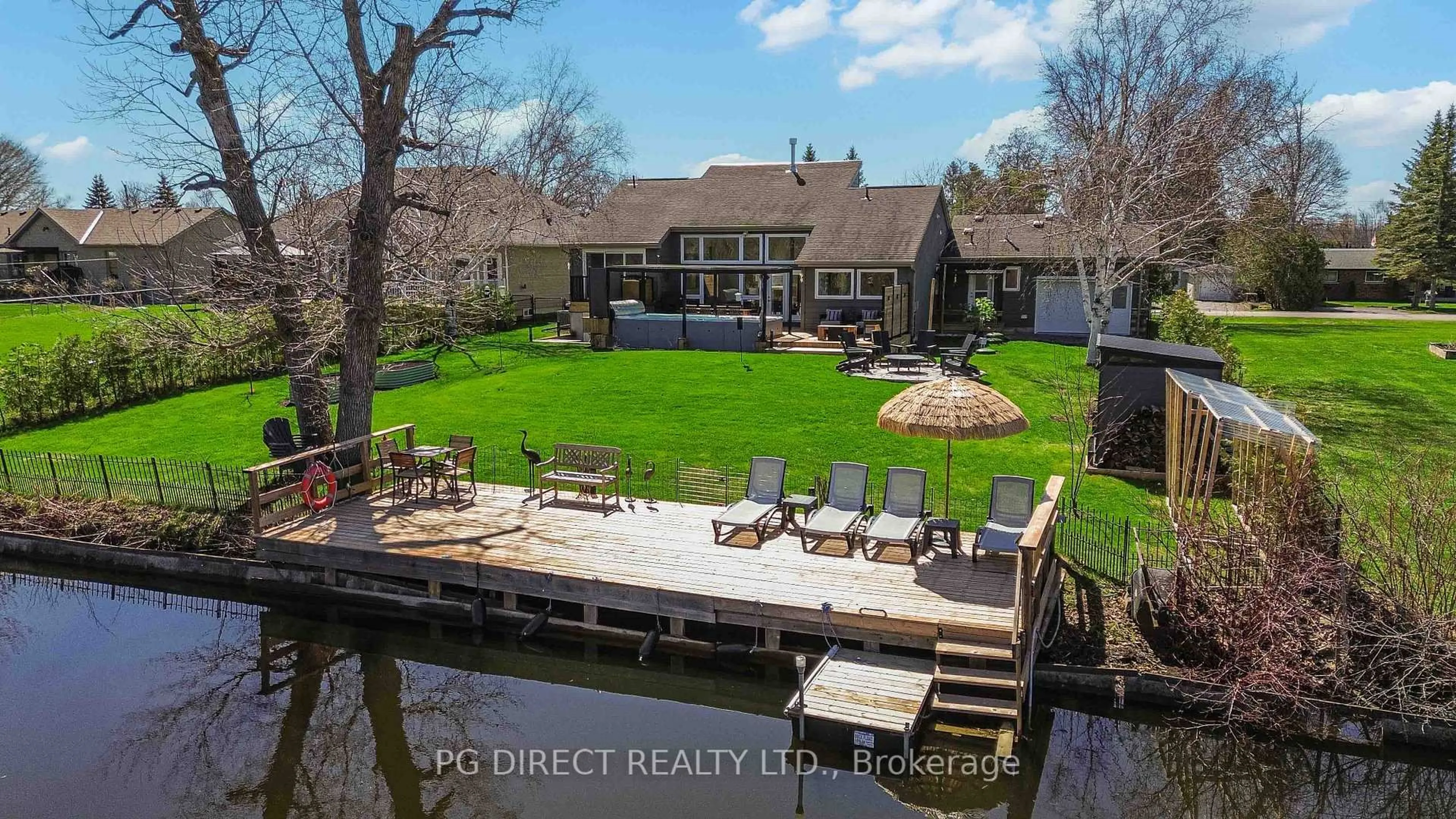 A pic from outside/outdoor area/front of a property/back of a property/a pic from drone, water/lake/river/ocean view for 18 Villa Dr, Georgina Ontario L0E 1N0