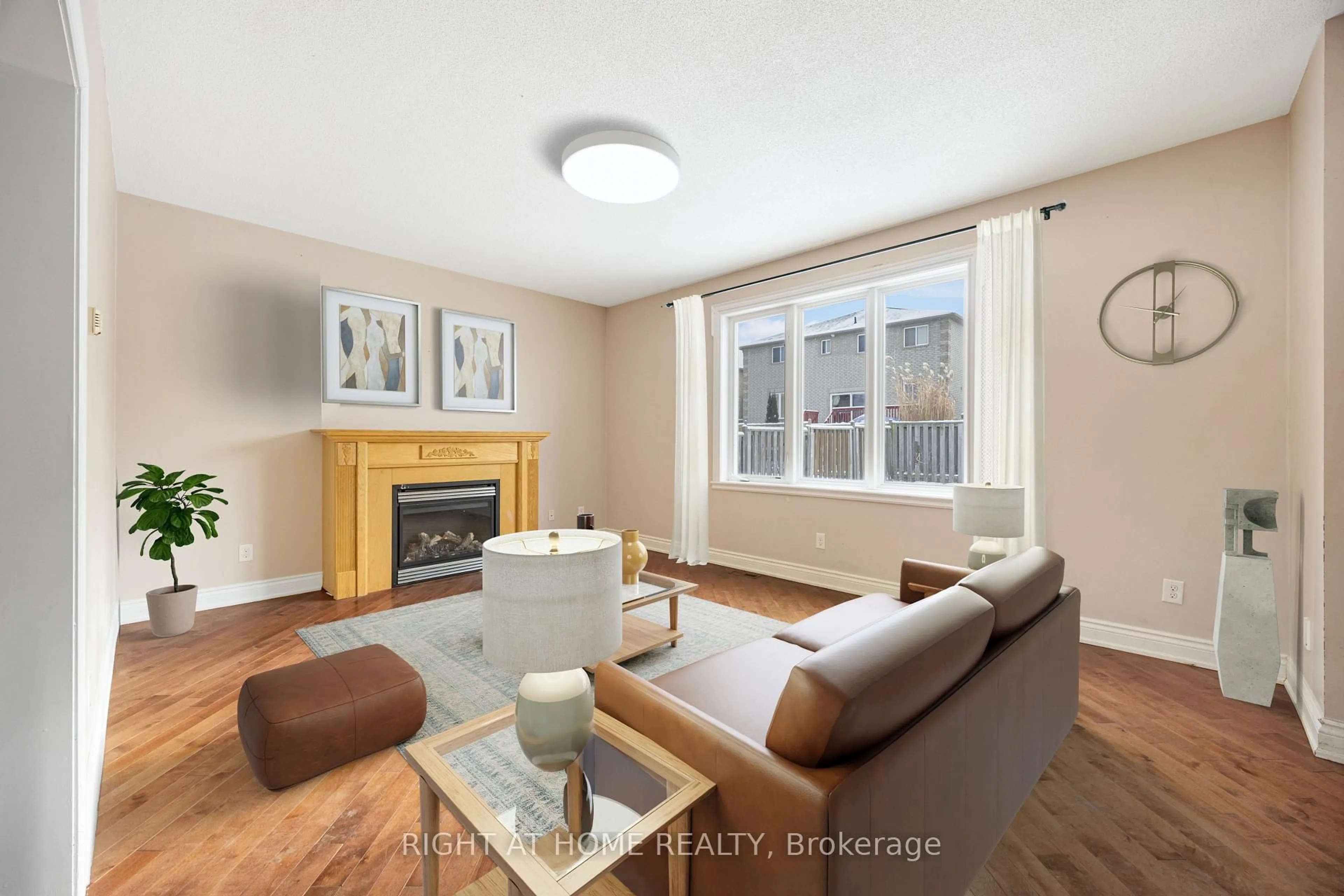 Living room with furniture, wood/laminate floor for 1215 Lowrie St, Innisfil Ontario L9S 0E5