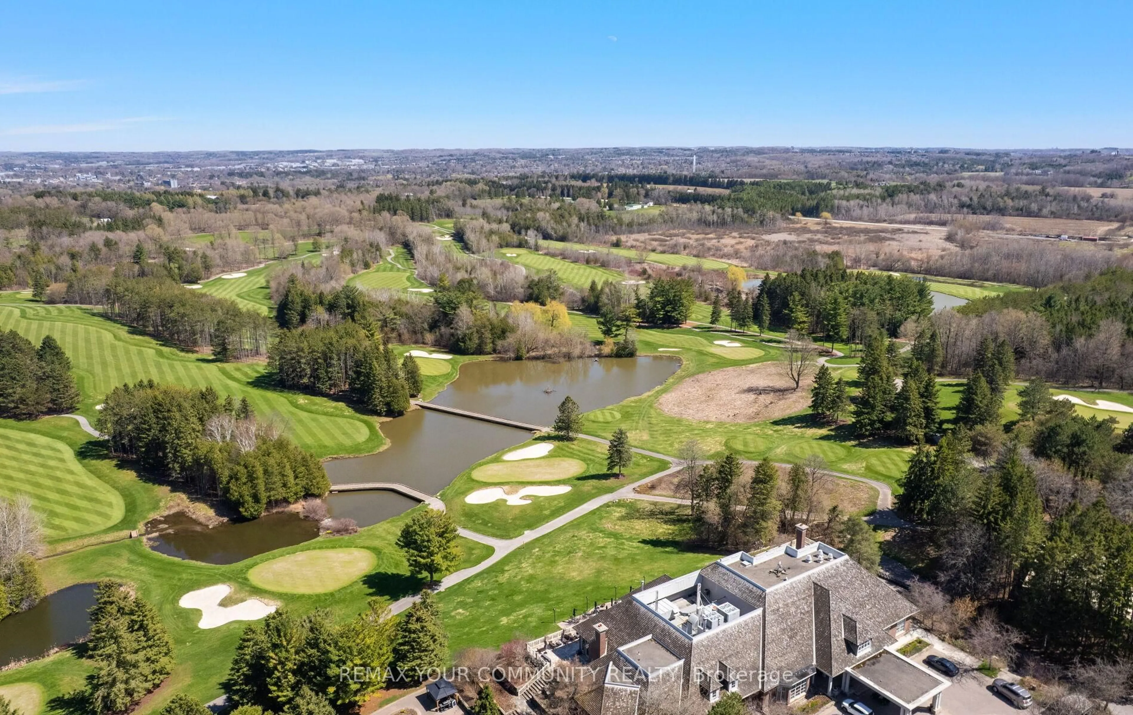 A pic from outside/outdoor area/front of a property/back of a property/a pic from drone, water/lake/river/ocean view for 102 Country Club Dr, King Ontario L7B 1M4