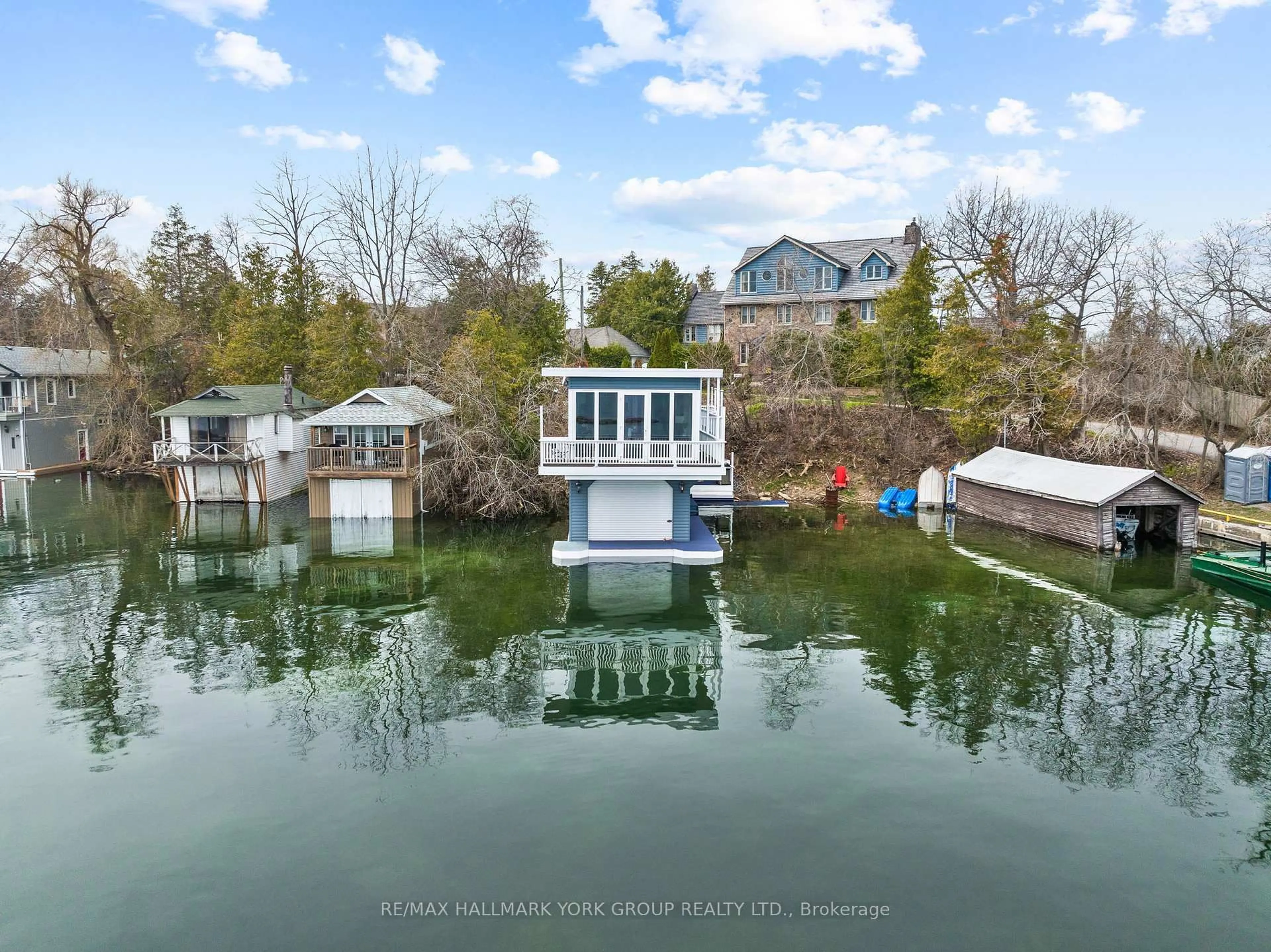A pic from outside/outdoor area/front of a property/back of a property/a pic from drone, water/lake/river/ocean view for 55 Malone Rd, Georgina Ontario L0E 1N0