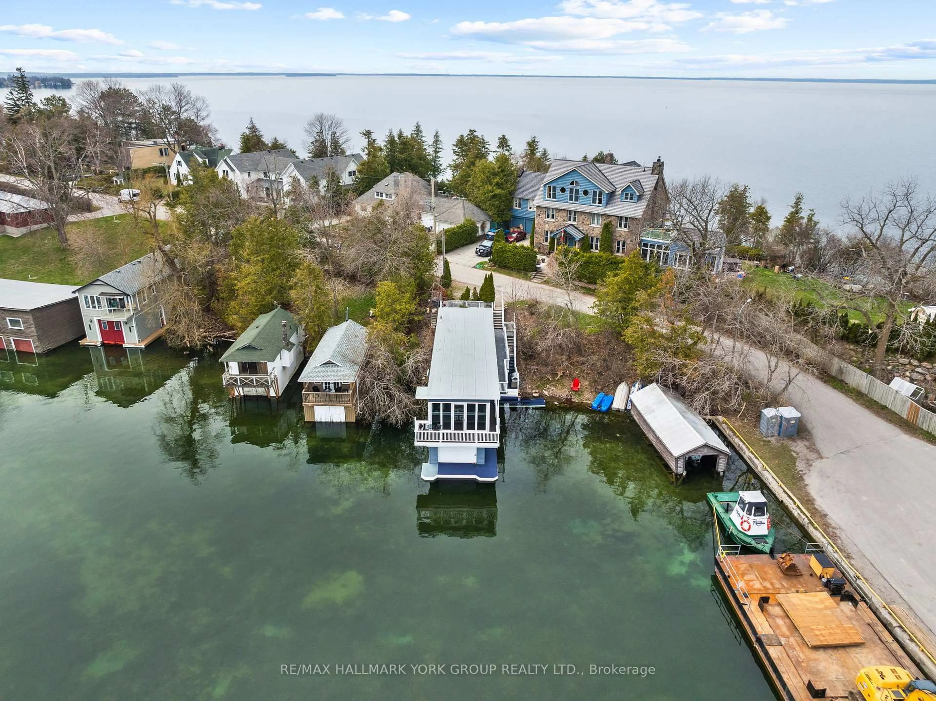 A pic from outside/outdoor area/front of a property/back of a property/a pic from drone, water/lake/river/ocean view for 55 Malone Rd, Georgina Ontario L0E 1N0