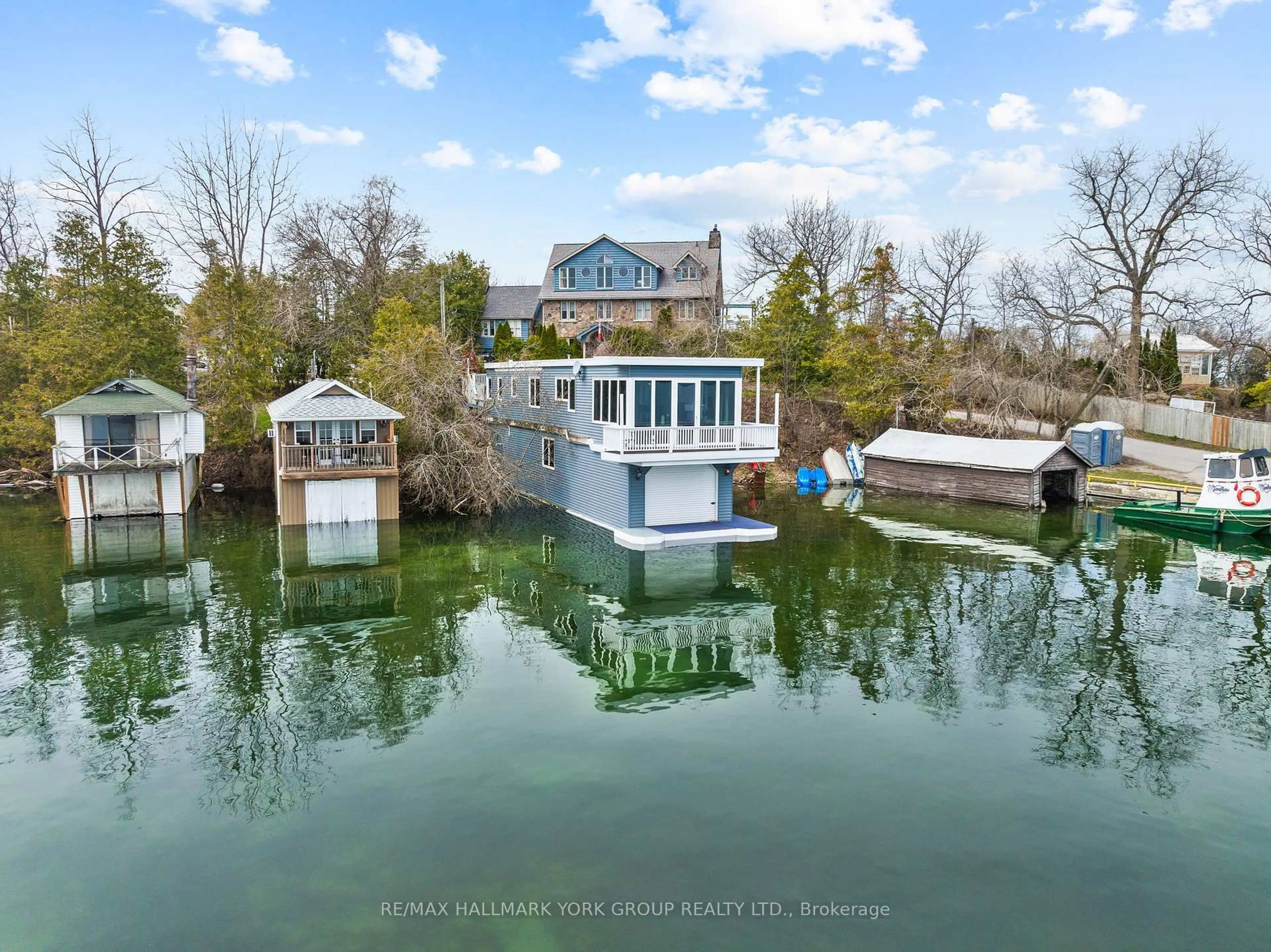 A pic from outside/outdoor area/front of a property/back of a property/a pic from drone, water/lake/river/ocean view for 55 Malone Rd, Georgina Ontario L0E 1N0