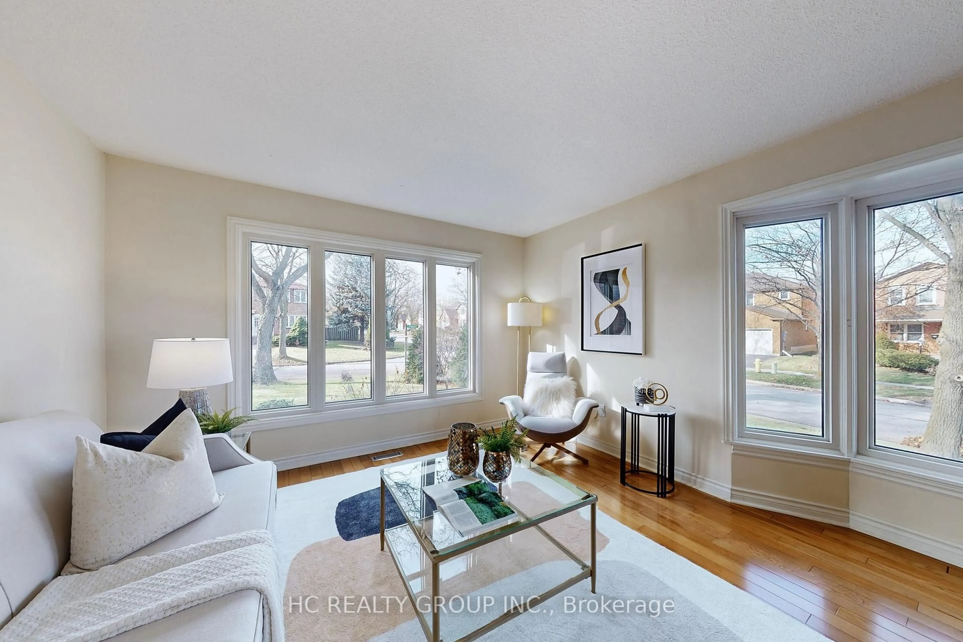 Living room with furniture, wood/laminate floor for 1 Atwood Crt, Markham Ontario L3T 6T4