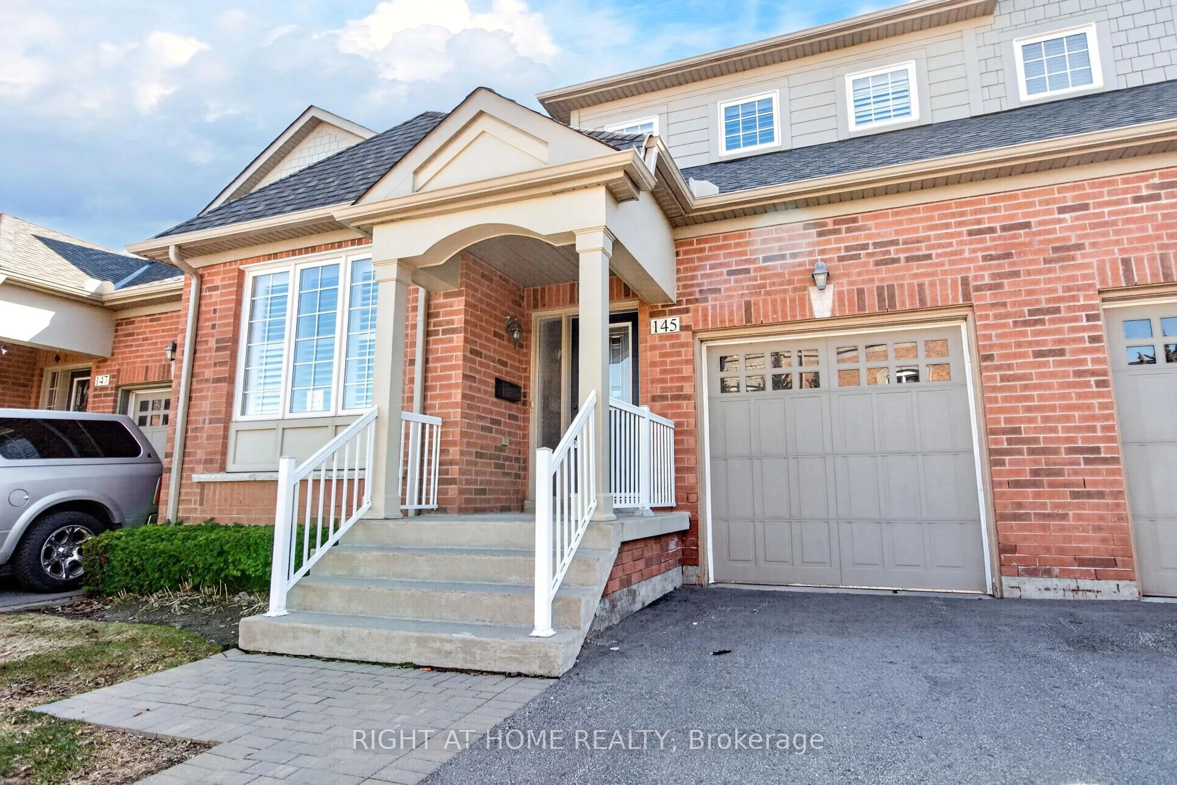 Home with brick exterior material, street for 145 Louisbourg Way, Markham Ontario L6E 2A2