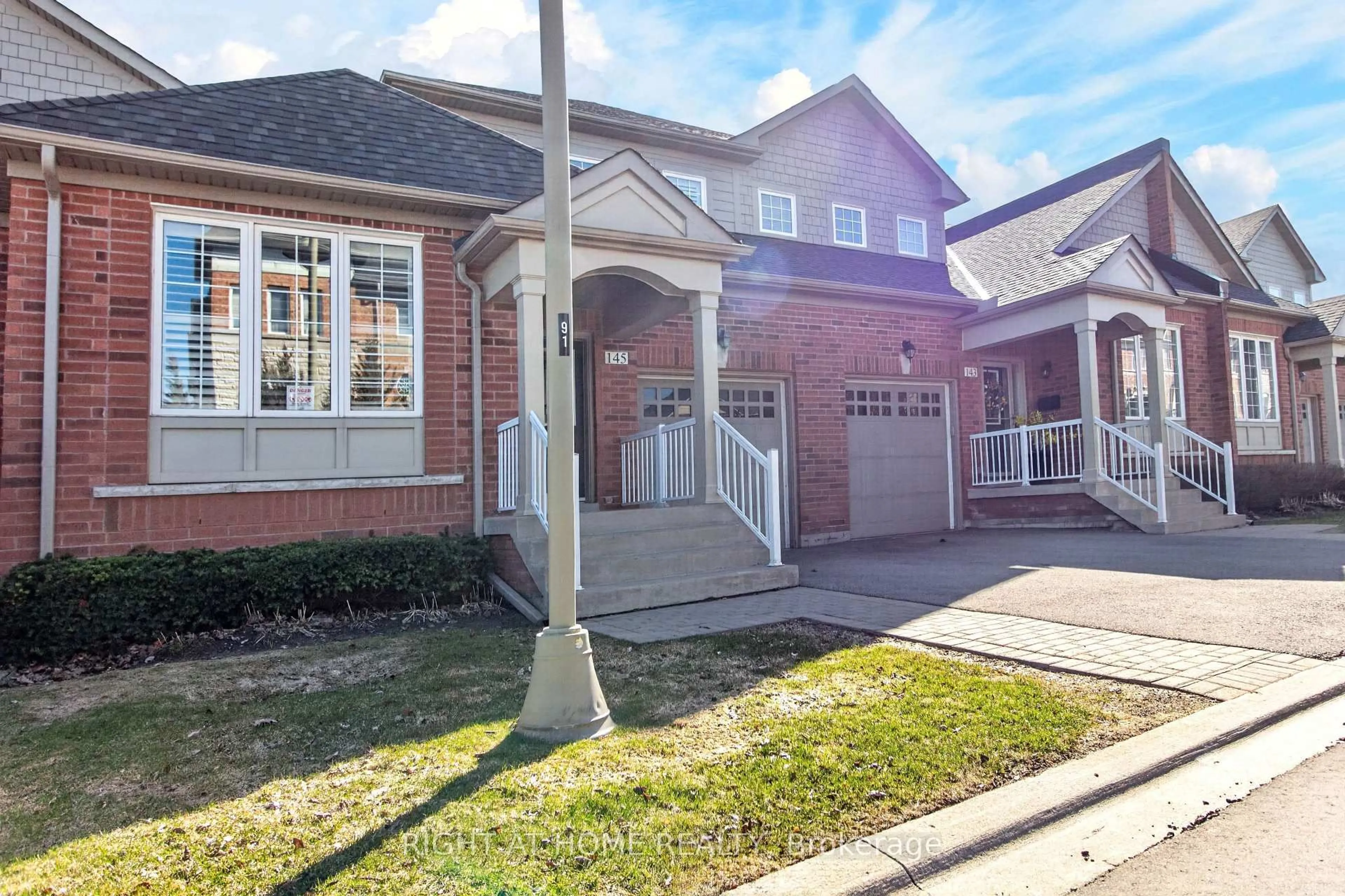 Home with brick exterior material, street for 145 Louisbourg Way, Markham Ontario L6E 2A2