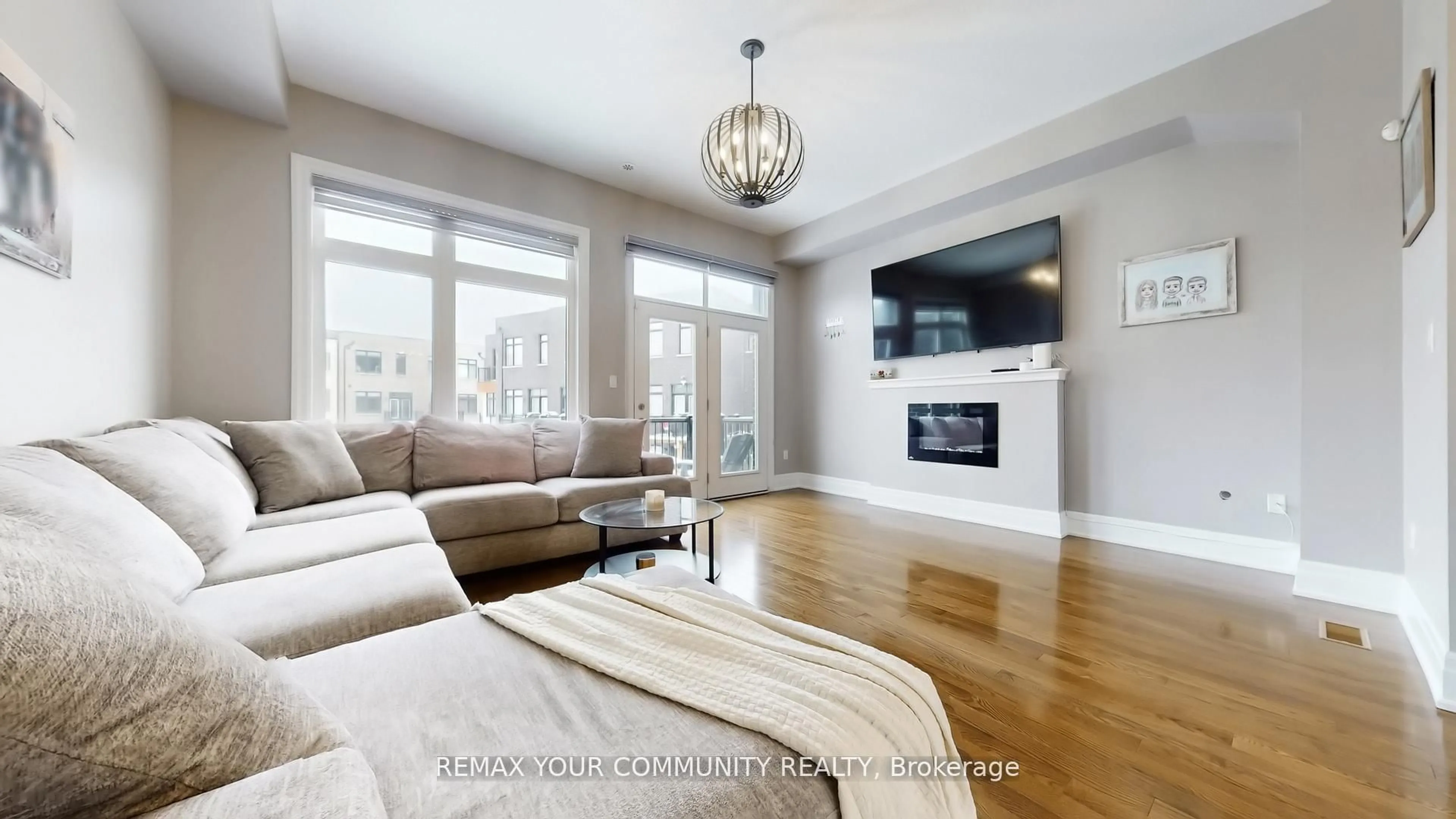 Living room with furniture, wood/laminate floor for 251 Thomas Cook Ave, Vaughan Ontario L6A 5A1
