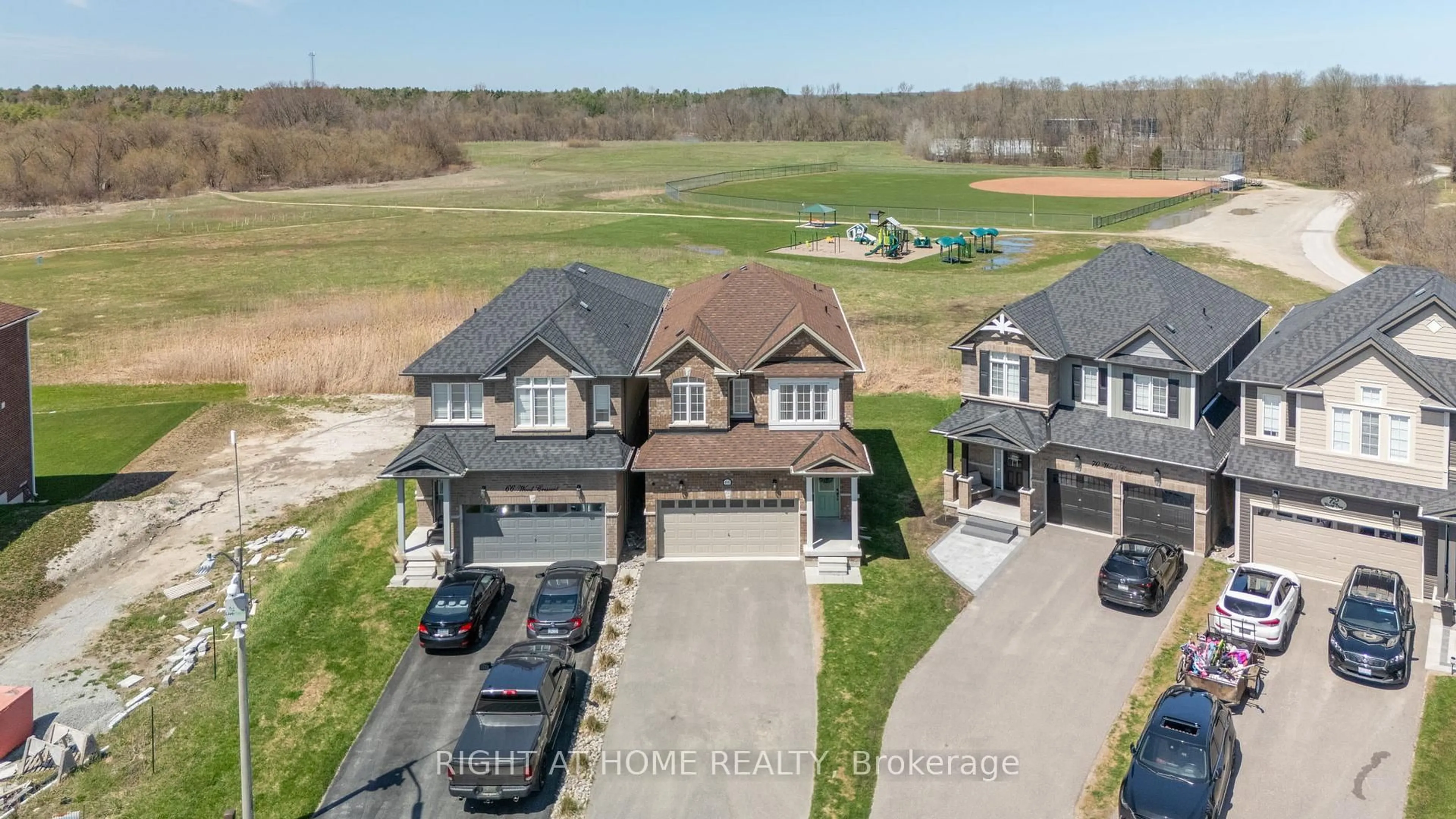 A pic from outside/outdoor area/front of a property/back of a property/a pic from drone, unknown for 68 Wood Cres, Essa Ontario L3W 0M5