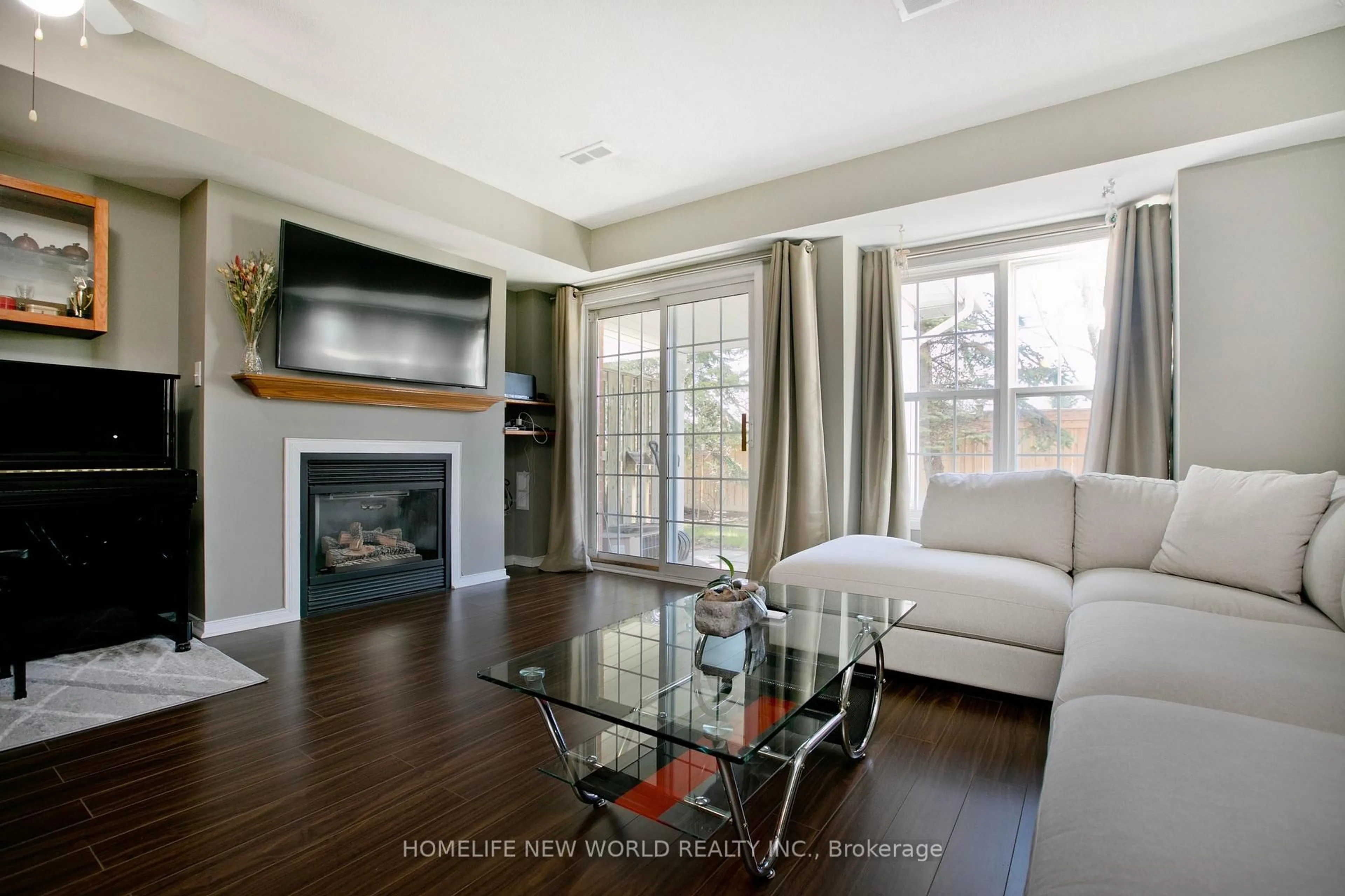 Living room with furniture, wood/laminate floor for 694 Limpert Terr, Newmarket Ontario L3Y 8R2