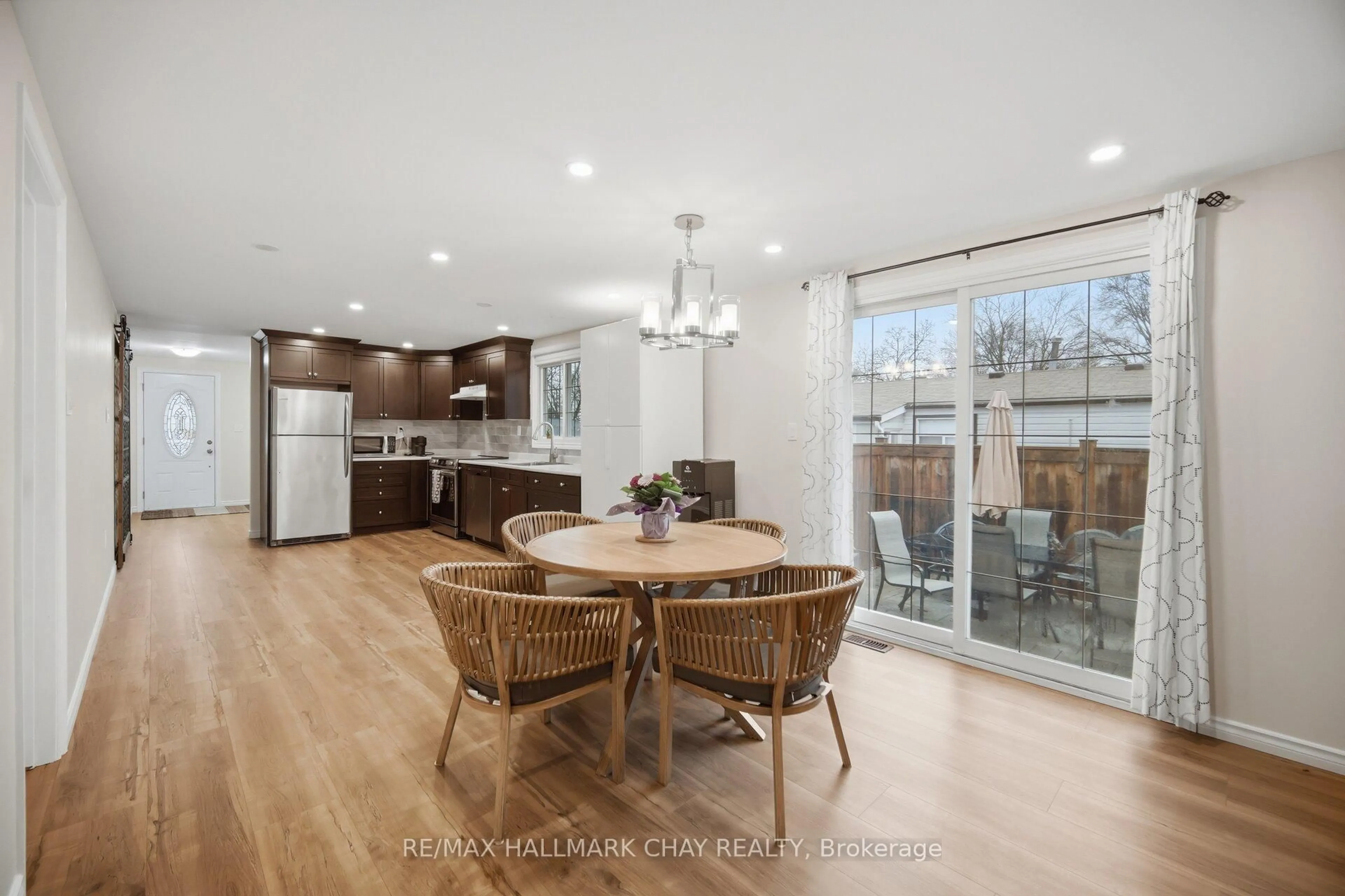 Open concept kitchen, wood/laminate floor for 97 Walkem Dr, New Tecumseth Ontario L0G 1W0
