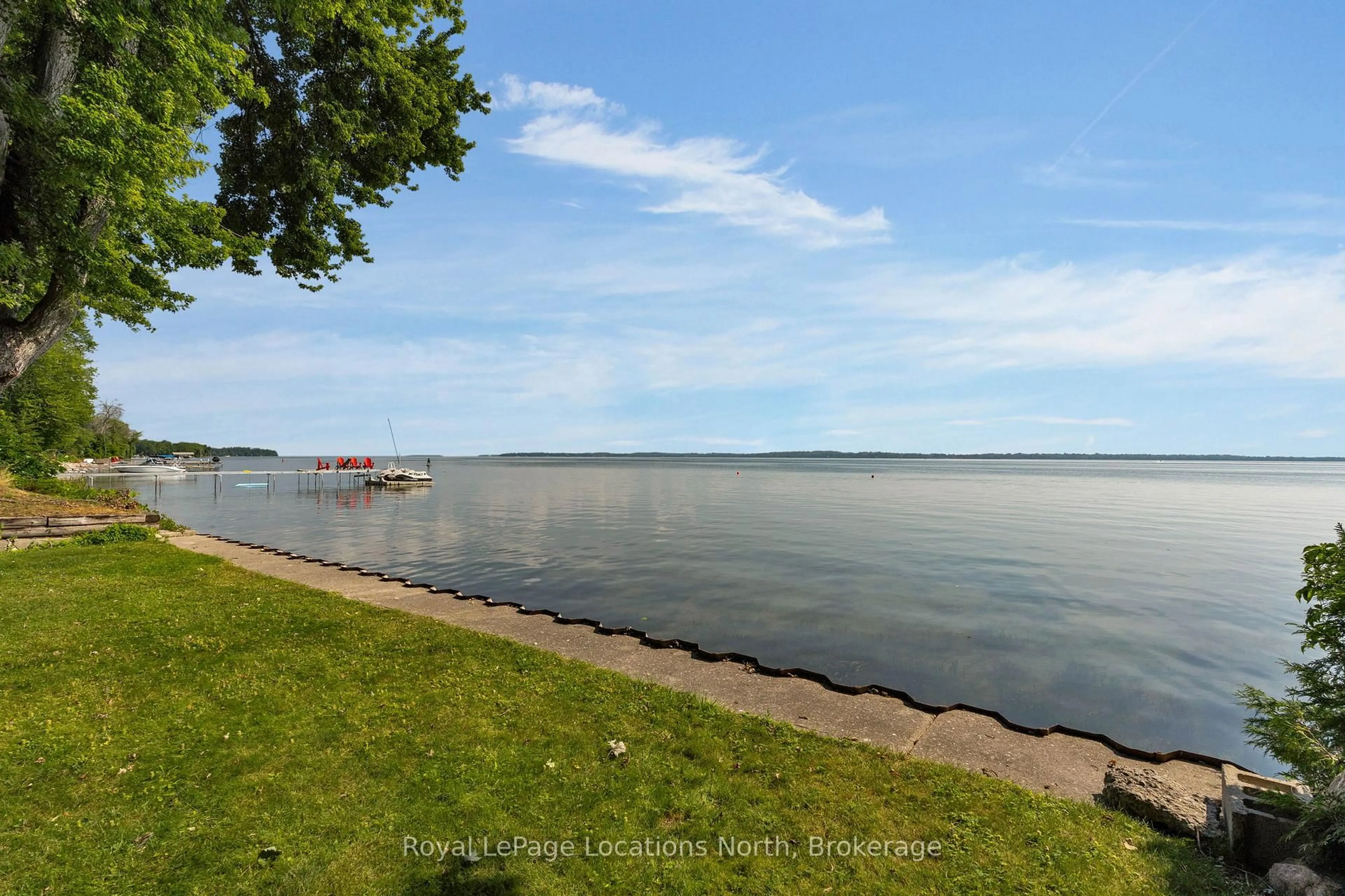 A pic from outside/outdoor area/front of a property/back of a property/a pic from drone, water/lake/river/ocean view for 297 Beach Rd, Innisfil Ontario L0L 1R0
