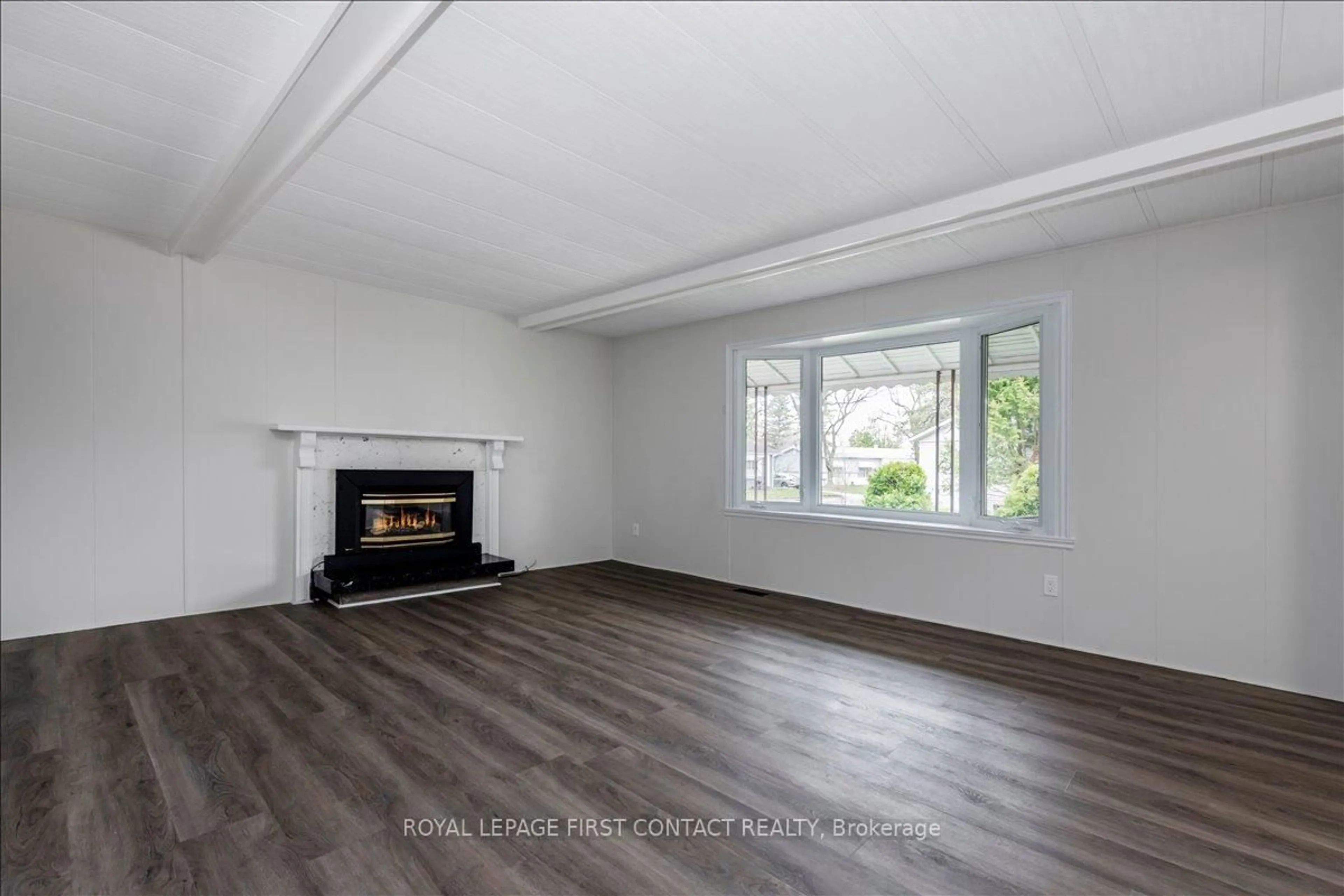 Living room with furniture, wood/laminate floor for 13 Honeysuckle Lane, Innisfil Ontario L9S 1M5