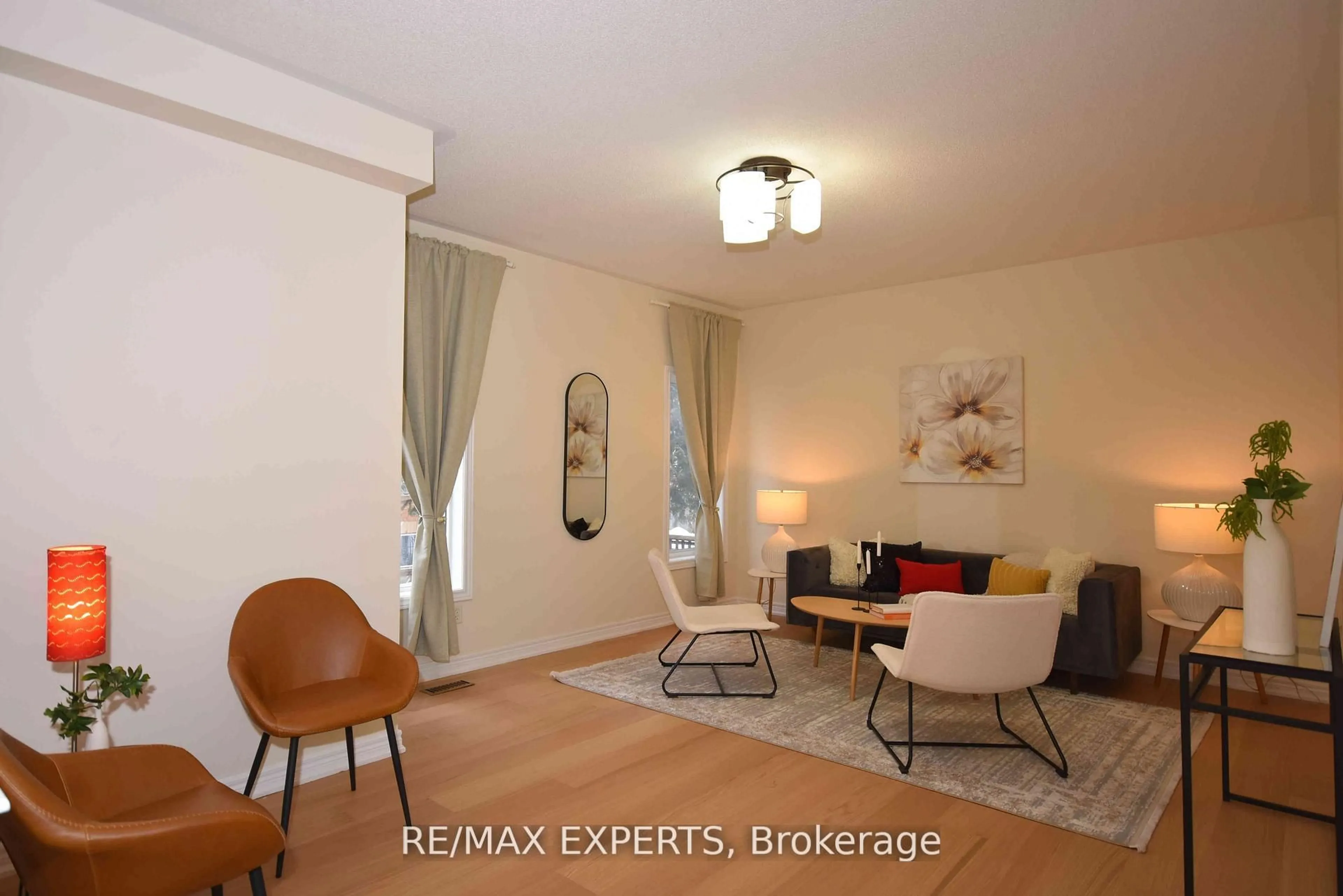 Living room with furniture, wood/laminate floor for 57 Drew Kelly Way #7, Markham Ontario L3R 5R2