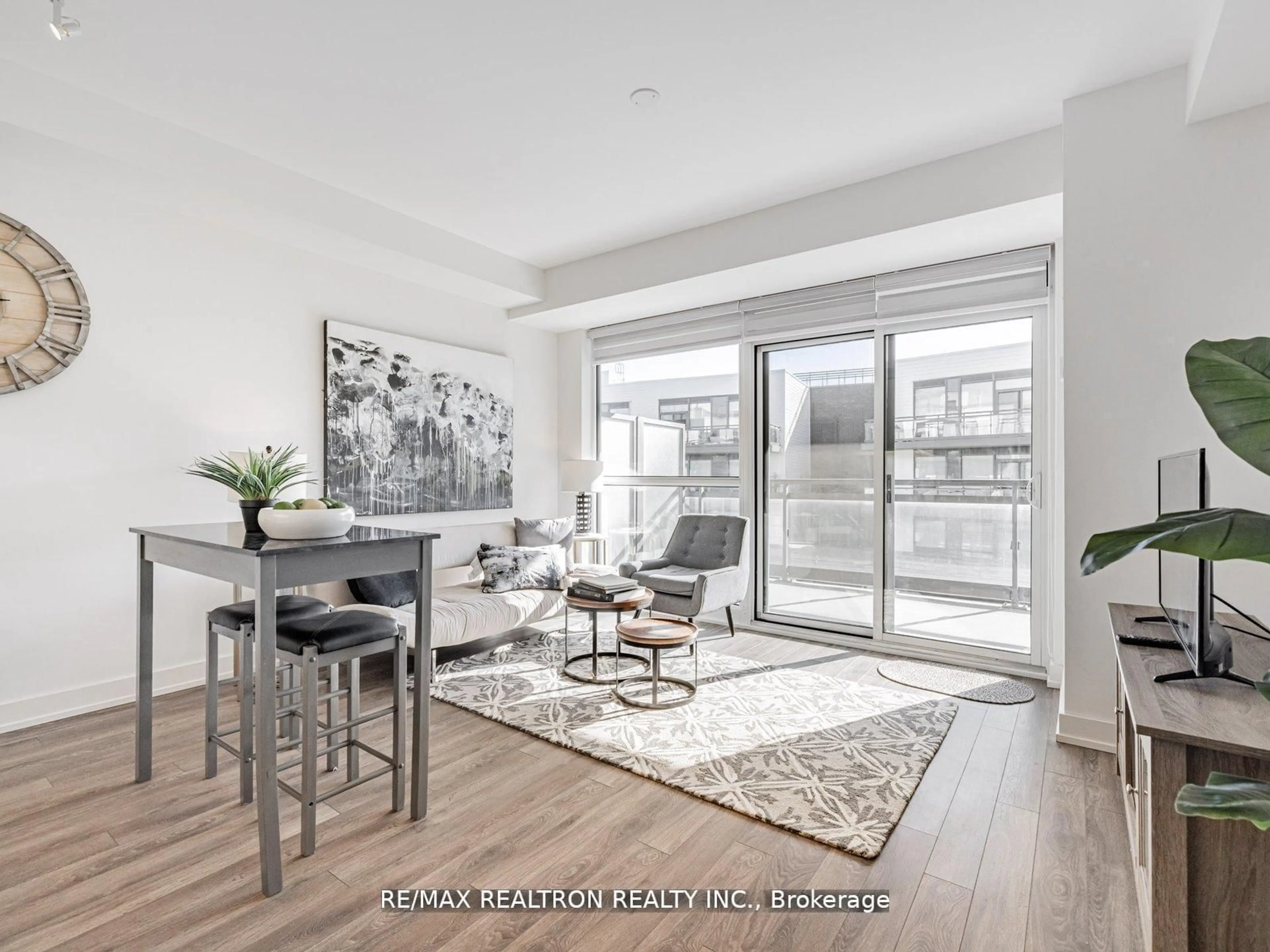 Living room with furniture, wood/laminate floor for 301 Sea Ray Ave #C312, Innisfil Ontario L9S 0L8