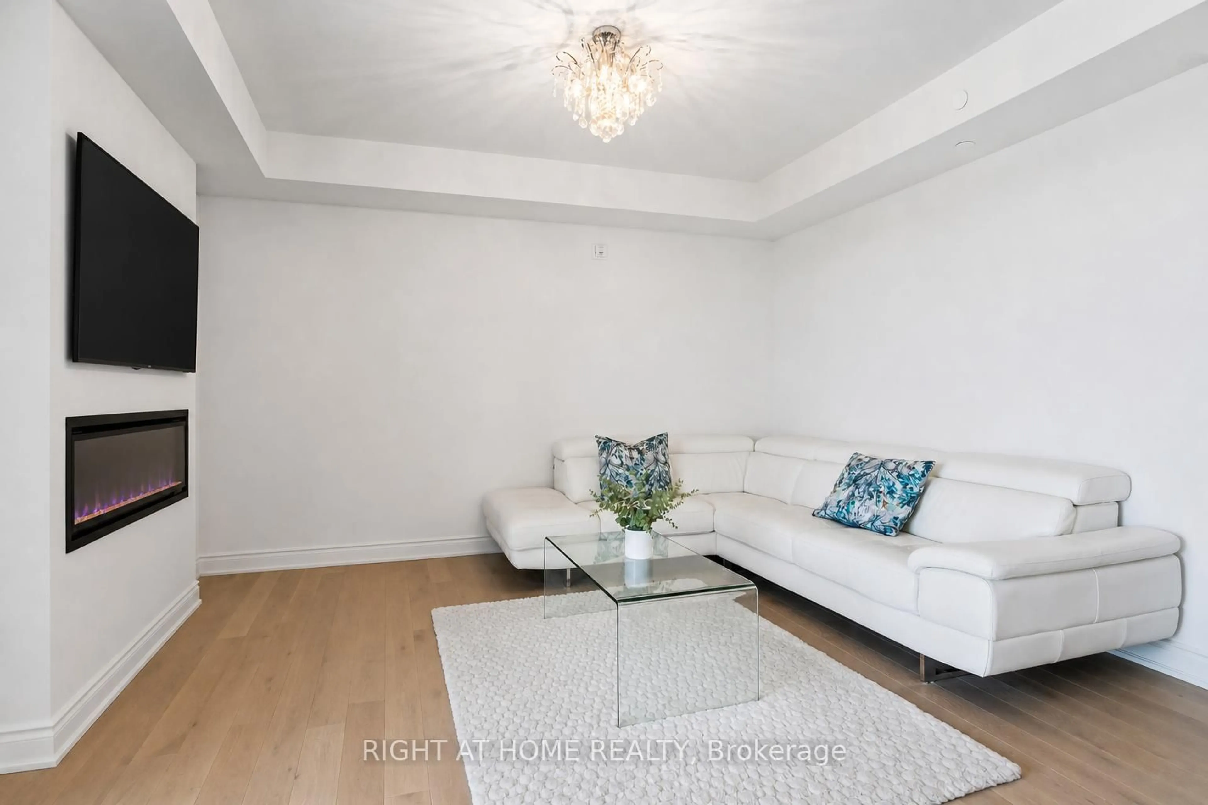 Living room with furniture, wood/laminate floor for 110 Grew Blvd #406, Georgina Ontario L0E 1L0