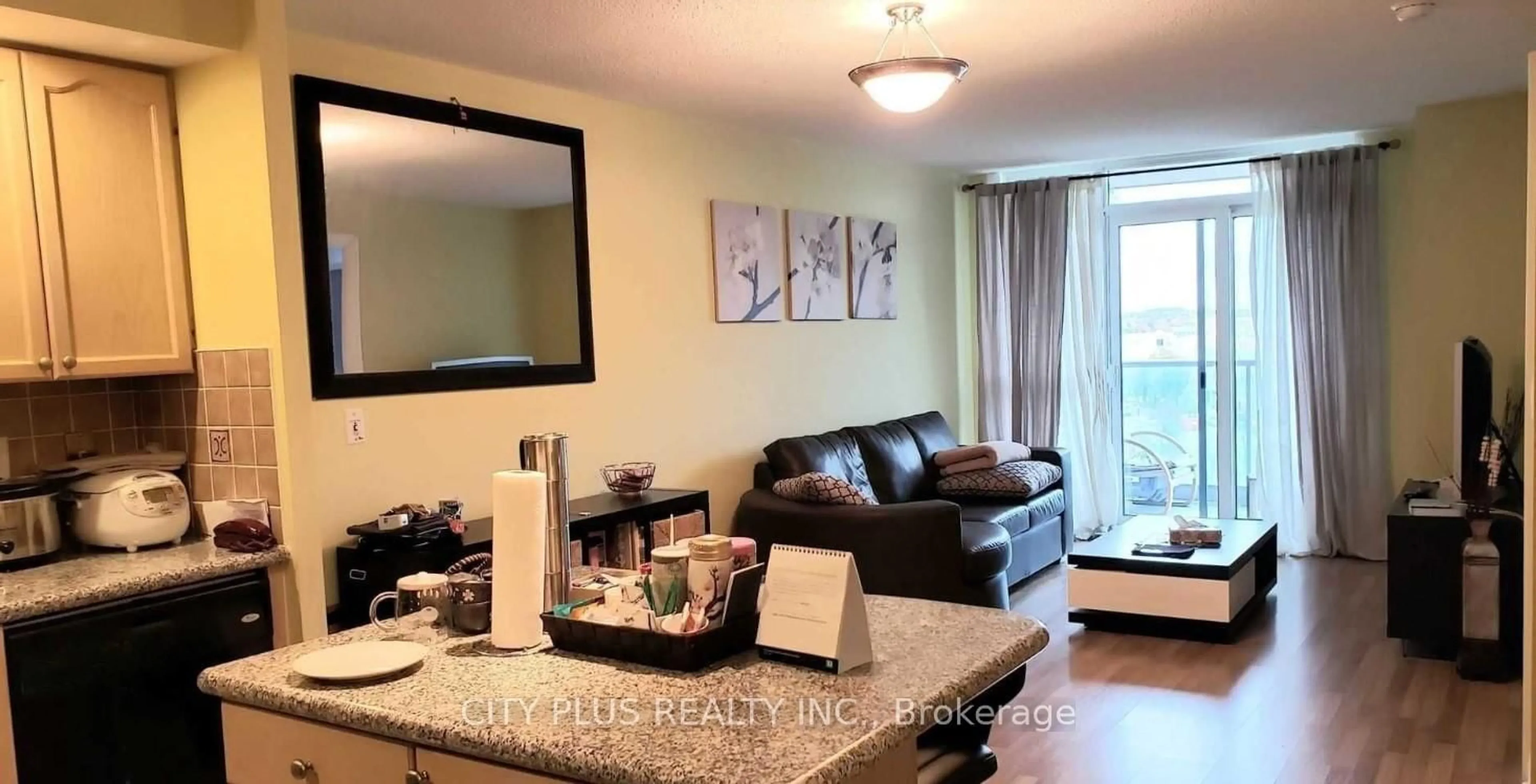 Living room with furniture, wood/laminate floor for 33 Cox Blvd #823, Markham Ontario L3R 8A6