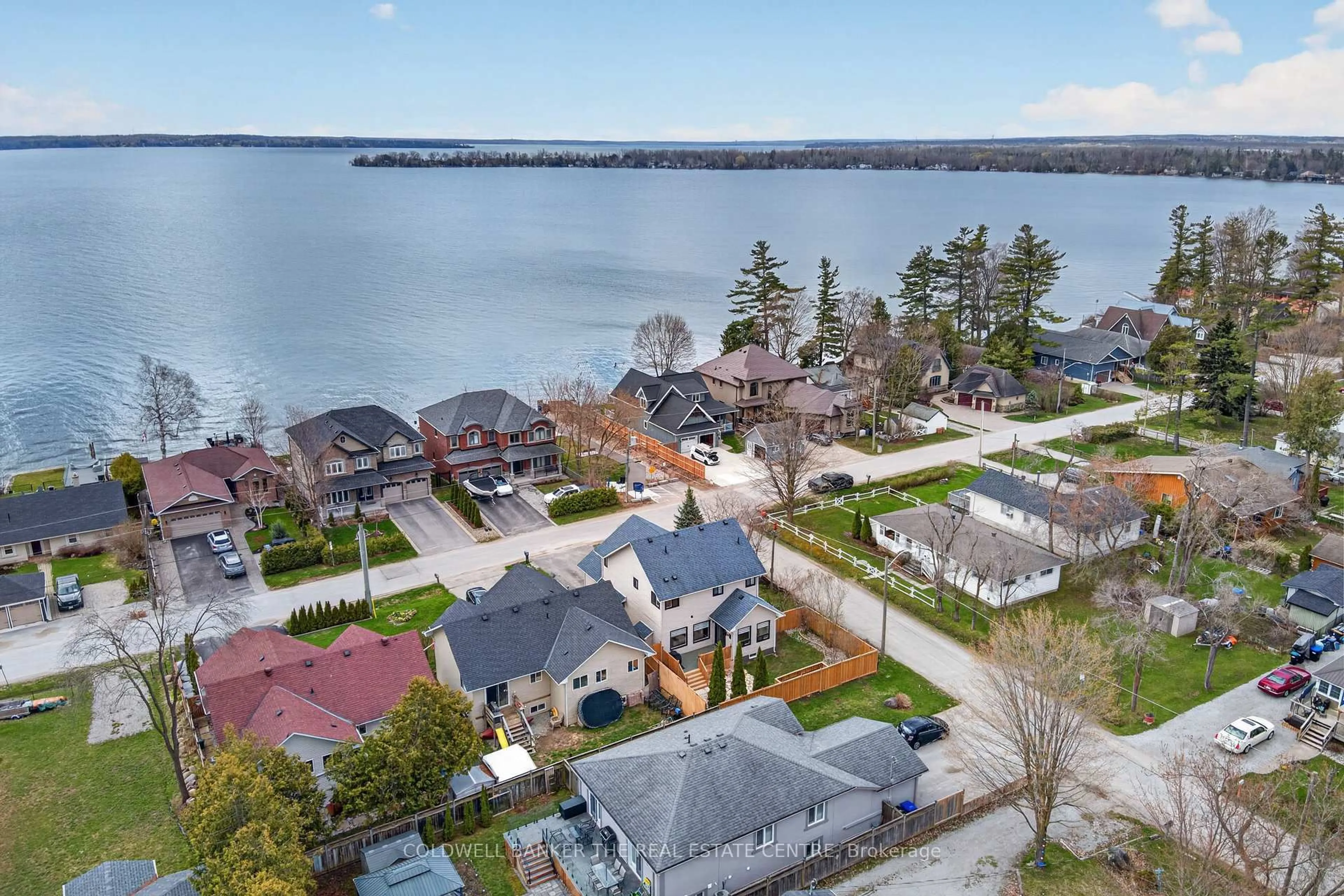 A pic from outside/outdoor area/front of a property/back of a property/a pic from drone, water/lake/river/ocean view for 684 Lakelands Ave, Innisfil Ontario L9S 4E6