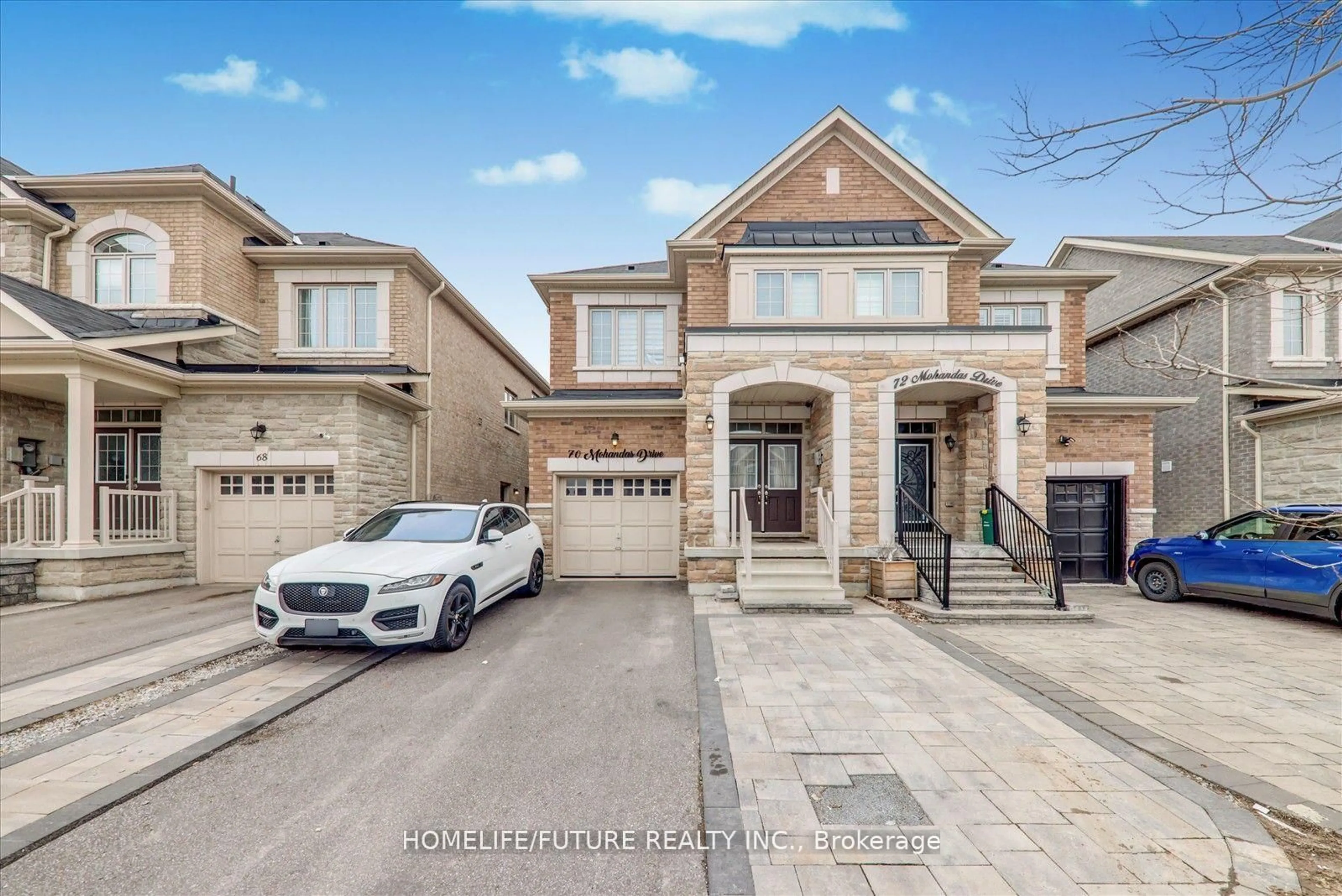 Home with brick exterior material, street for 70 Mohandas Dr, Markham Ontario L3S 0E4