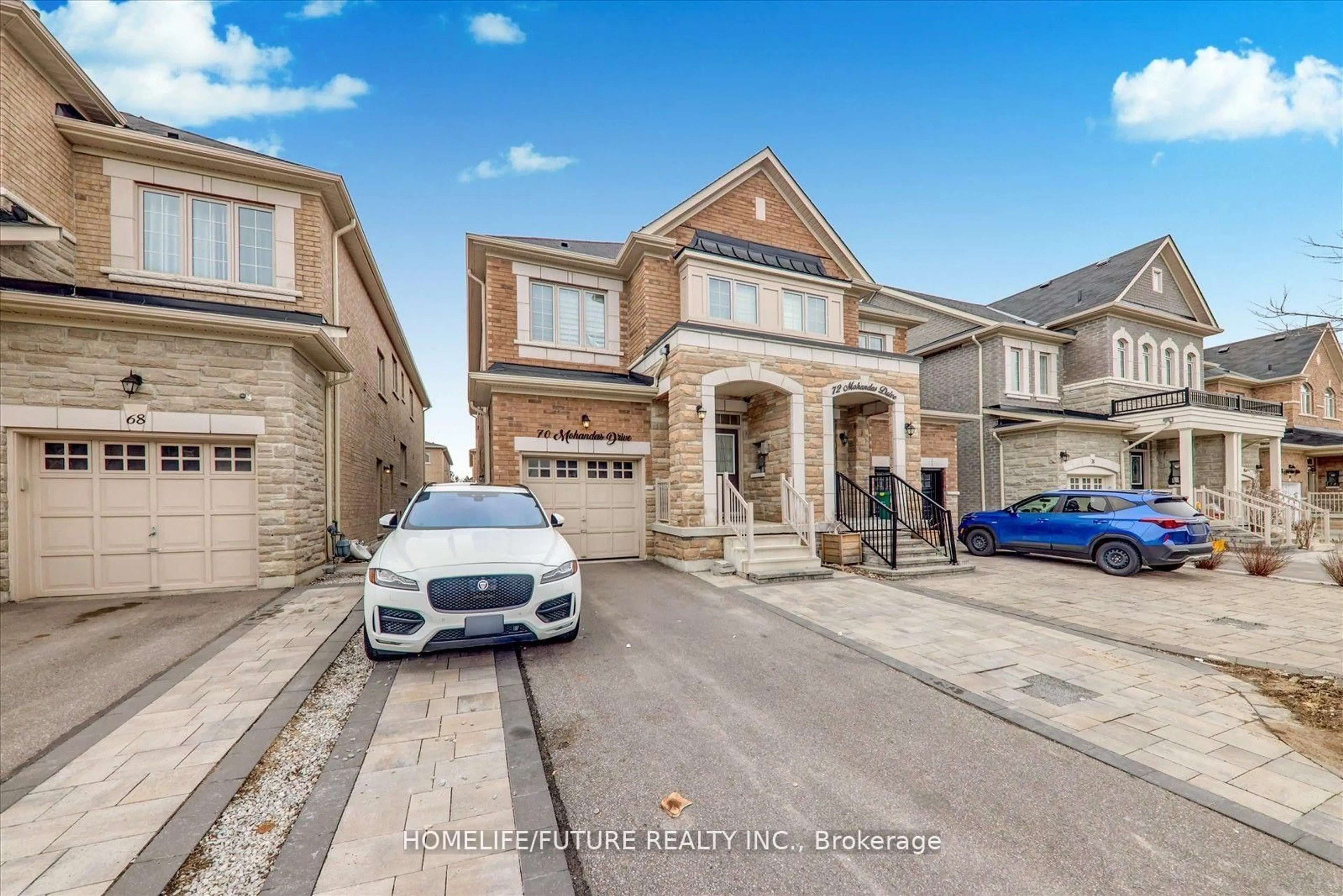 Home with brick exterior material, street for 70 Mohandas Dr, Markham Ontario L3S 0E4