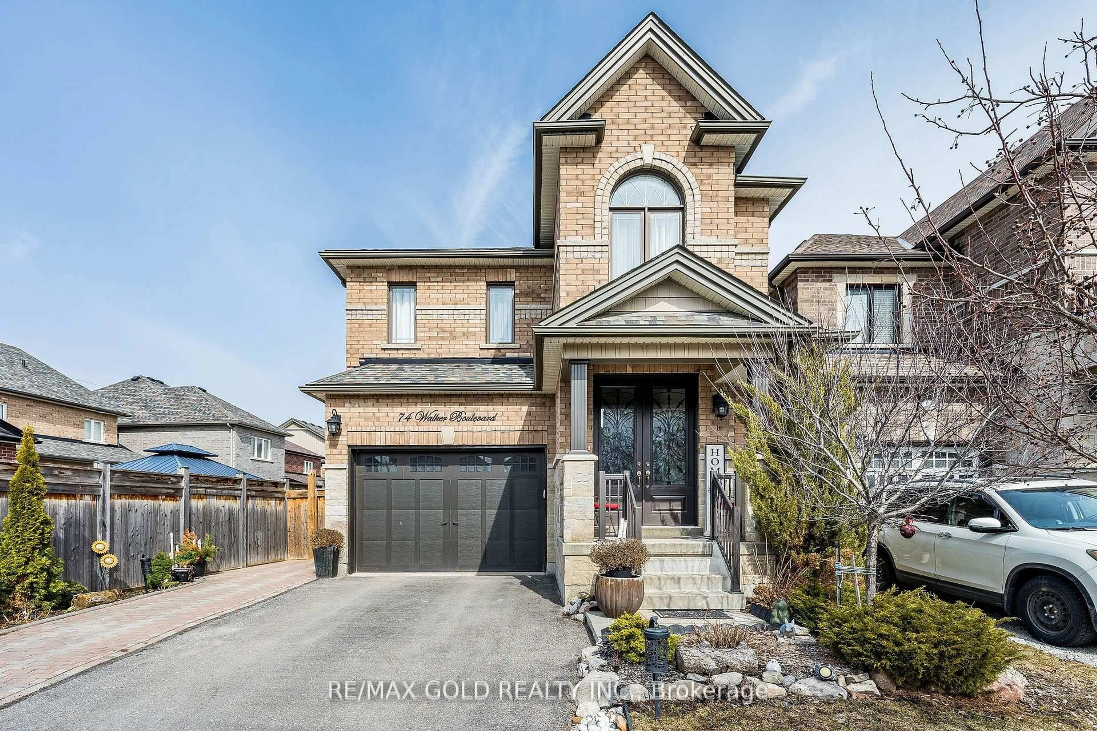 Home with brick exterior material, street for 74 Walker Blvd, New Tecumseth Ontario L9R 0N3