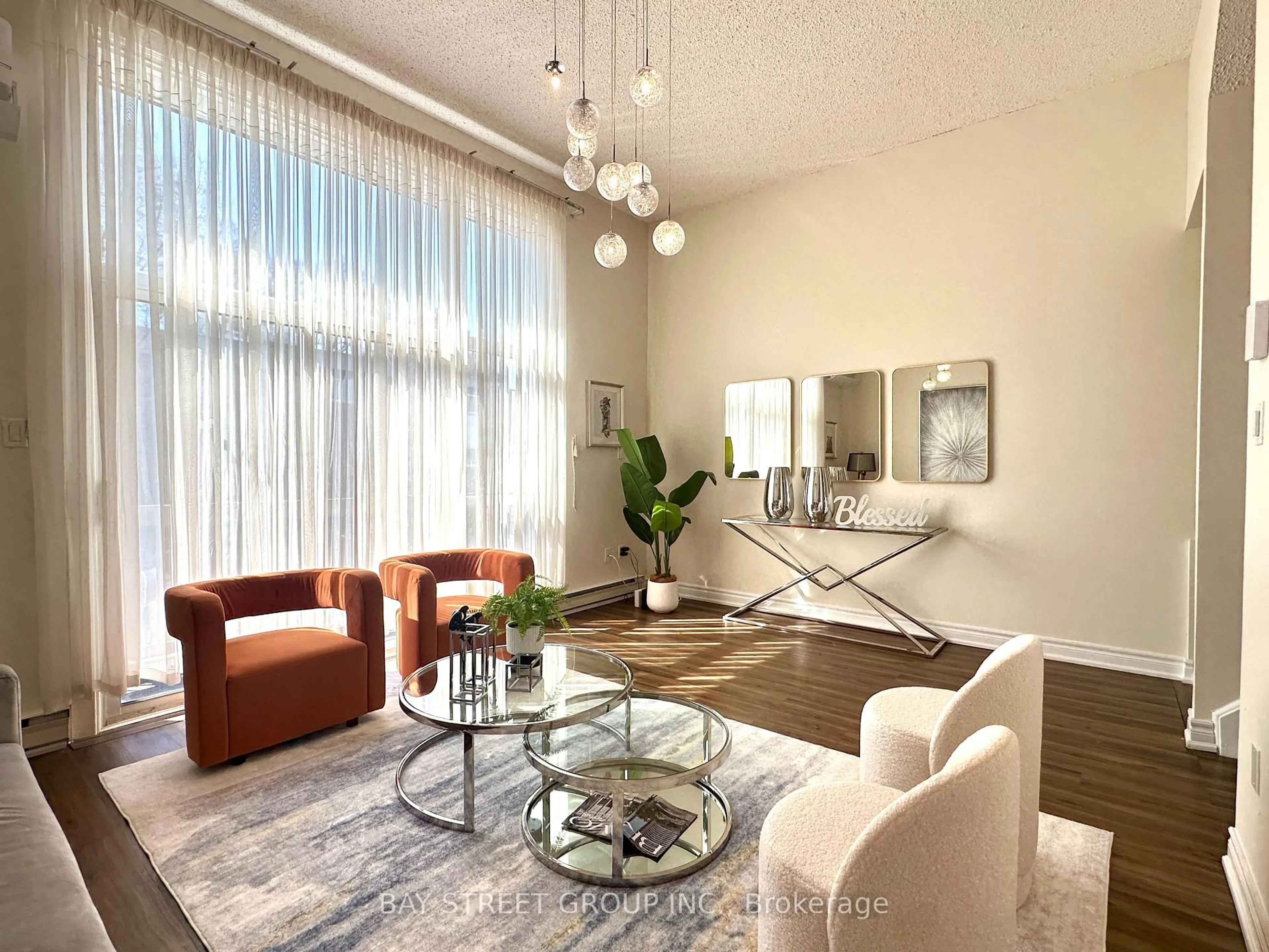 Living room with furniture, wood/laminate floor for 141 Clark Ave #30, Markham Ontario L3T 4P4