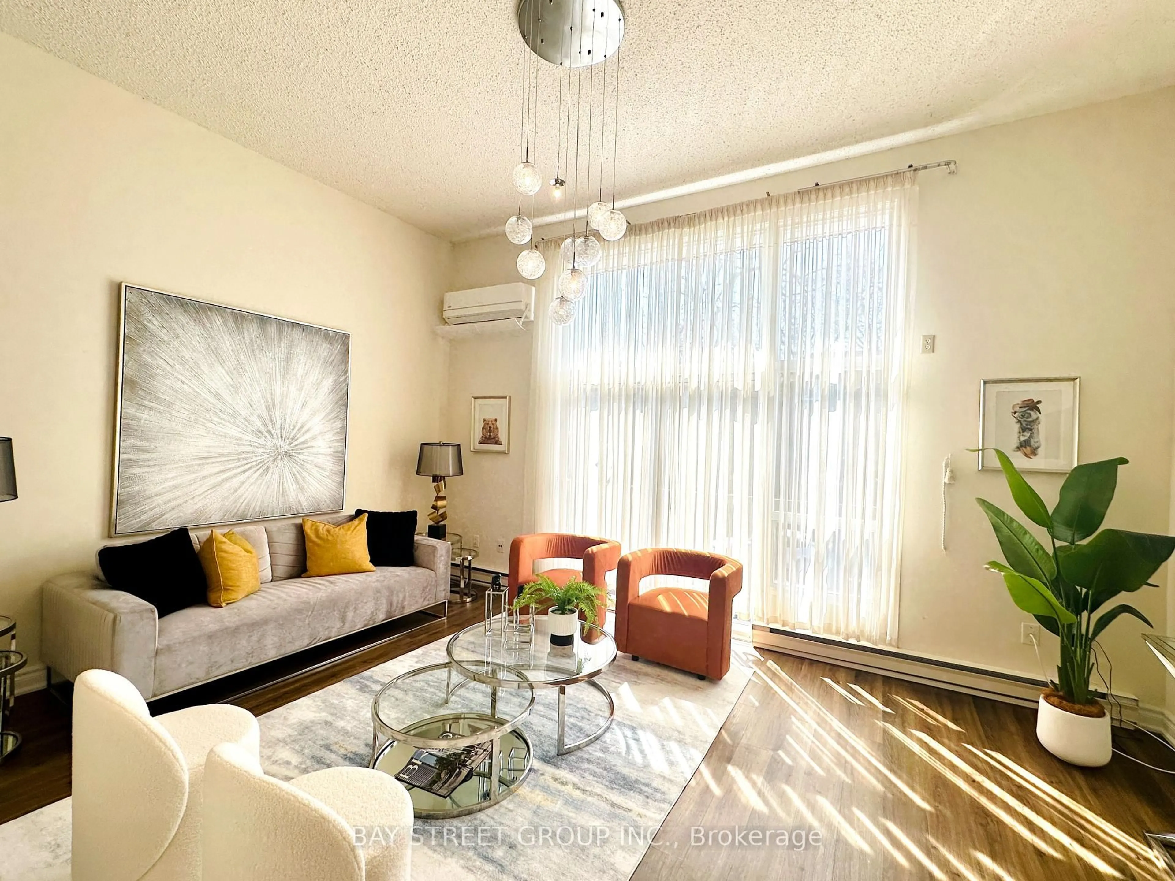 Living room with furniture, wood/laminate floor for 141 Clark Ave #30, Markham Ontario L3T 4P4