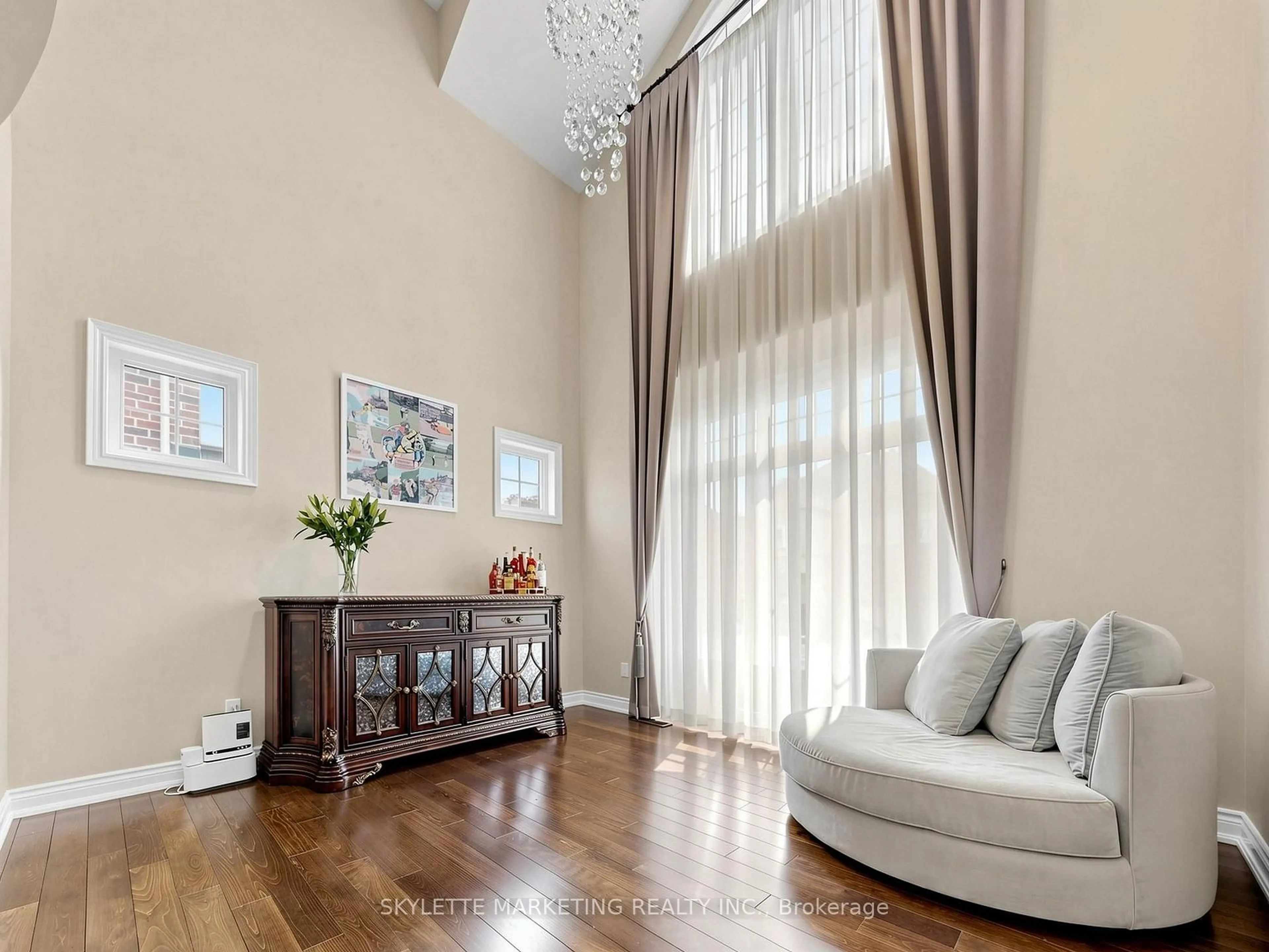 Living room with furniture, wood/laminate floor for 24 Royal West Rd, Markham Ontario L6C 0L5