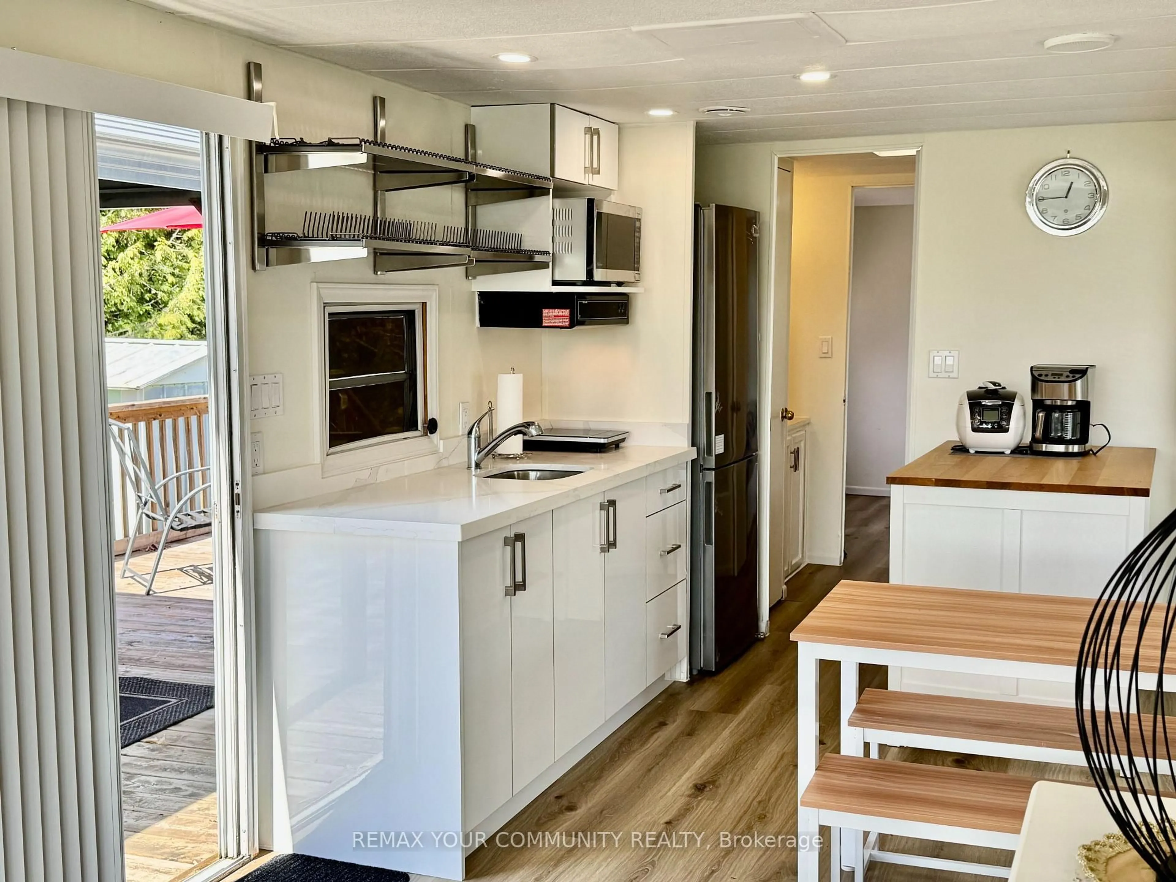Open concept kitchen, wood/laminate floor for 285 Crydermans Sdrd #237, Georgina Ontario L0E 1A0