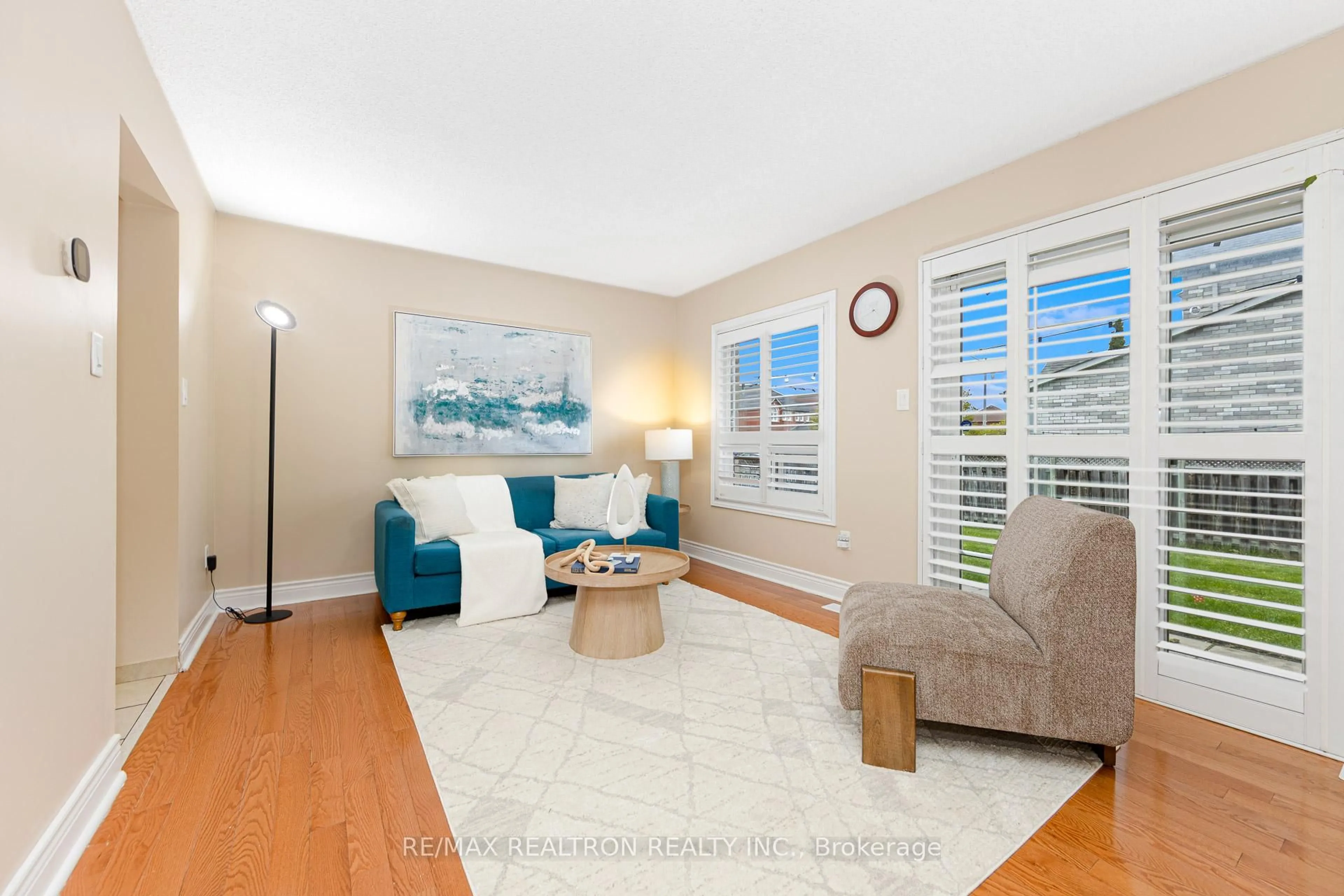 Living room with furniture, wood/laminate floor for 141 Laird Dr, Markham Ontario L3S 3N7