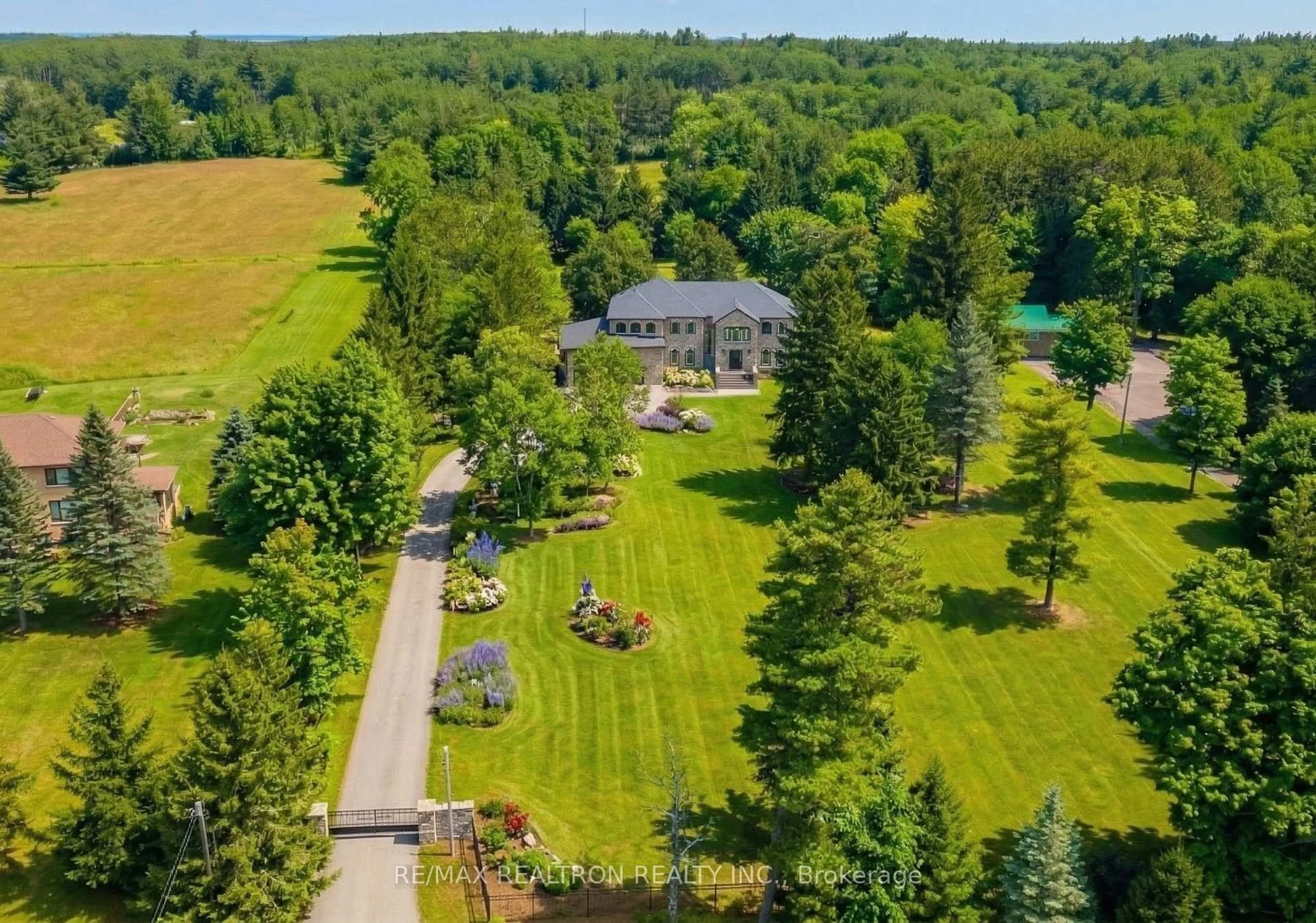 A pic from outside/outdoor area/front of a property/back of a property/a pic from drone, water/lake/river/ocean view for 14705 Jane St, King Ontario L7B 1A3