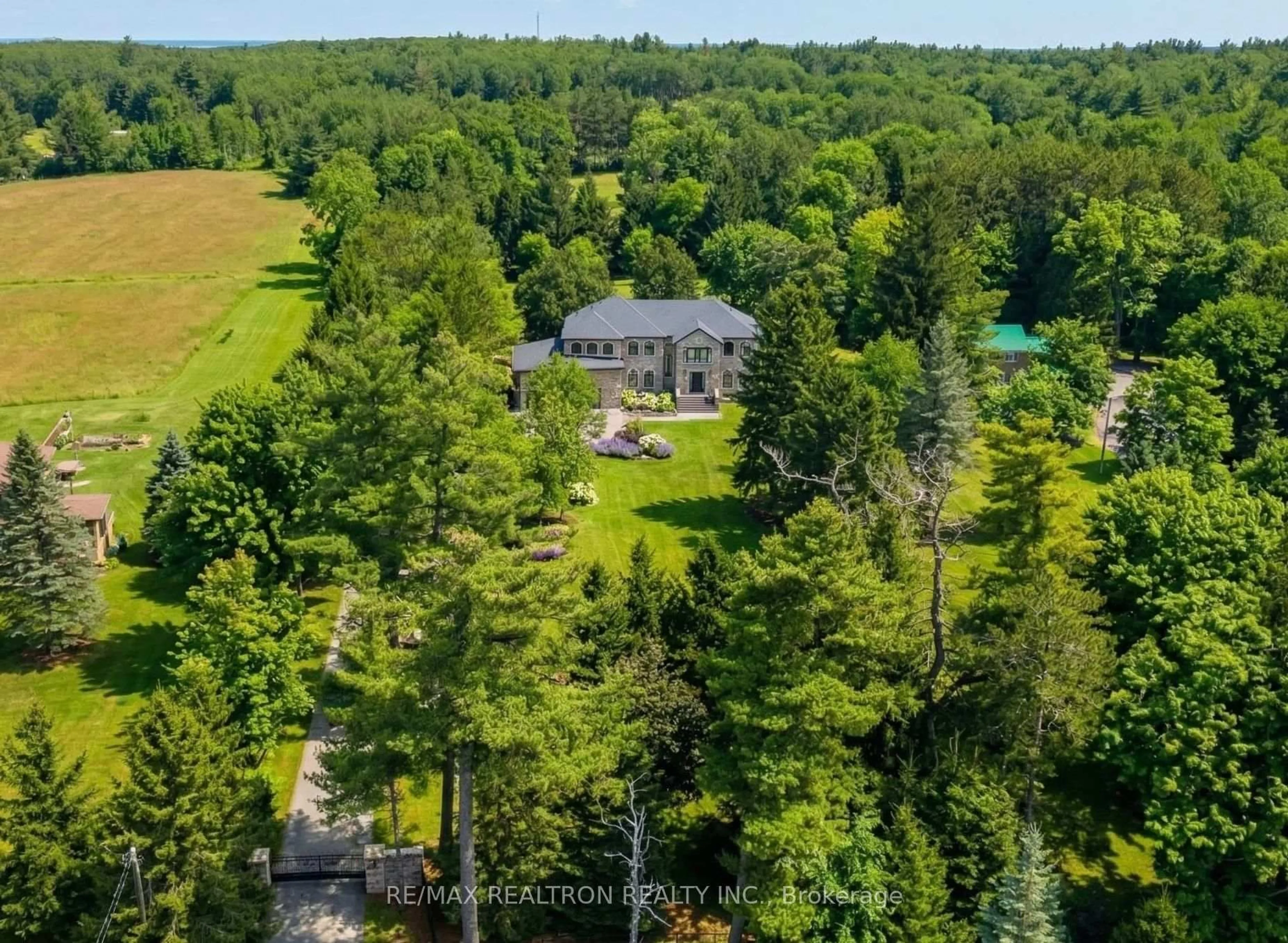 A pic from outside/outdoor area/front of a property/back of a property/a pic from drone, forest/trees view for 14705 Jane St, King Ontario L7B 1A3
