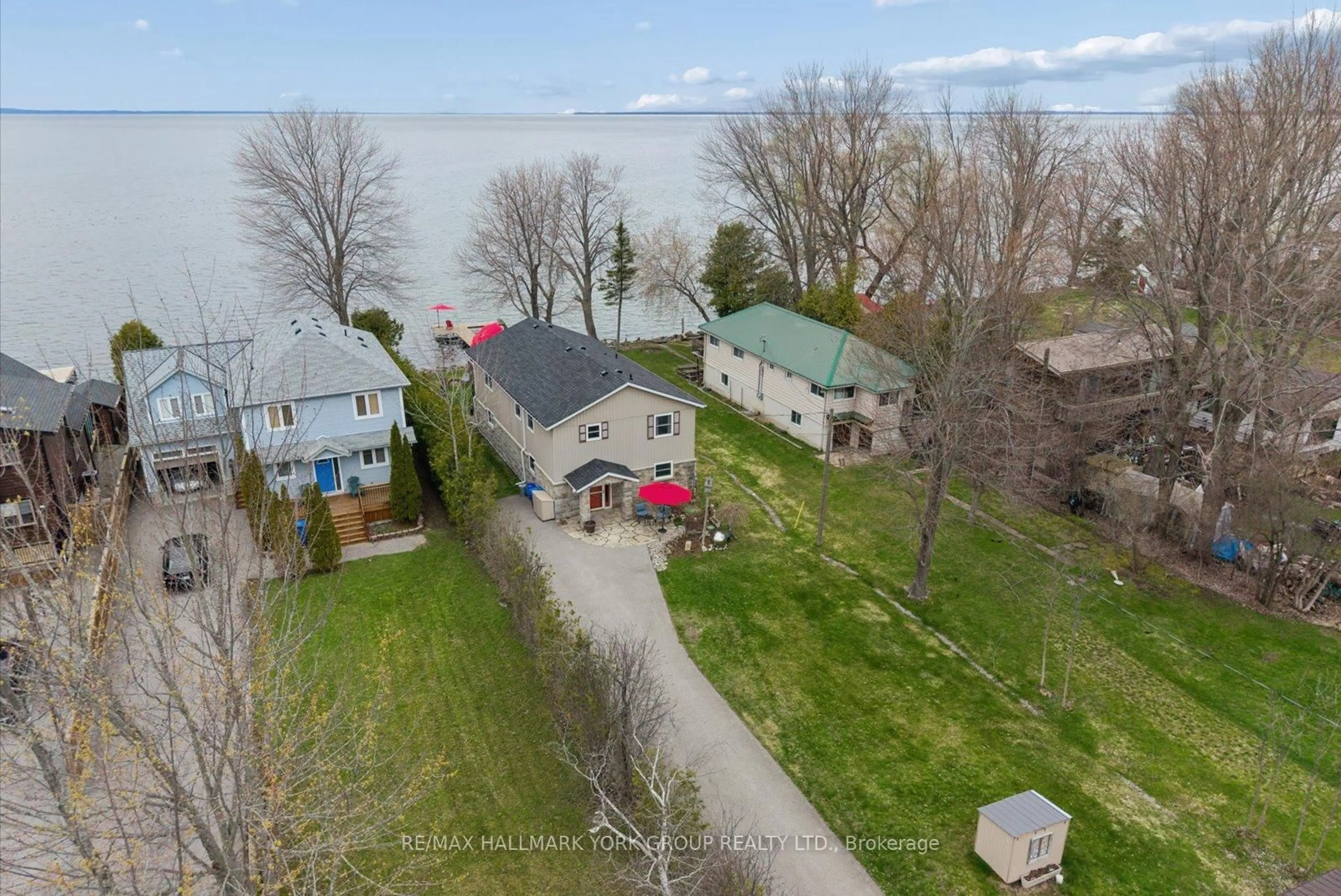 A pic from outside/outdoor area/front of a property/back of a property/a pic from drone, water/lake/river/ocean view for 168 Irving Dr, Georgina Ontario L0E 1L0