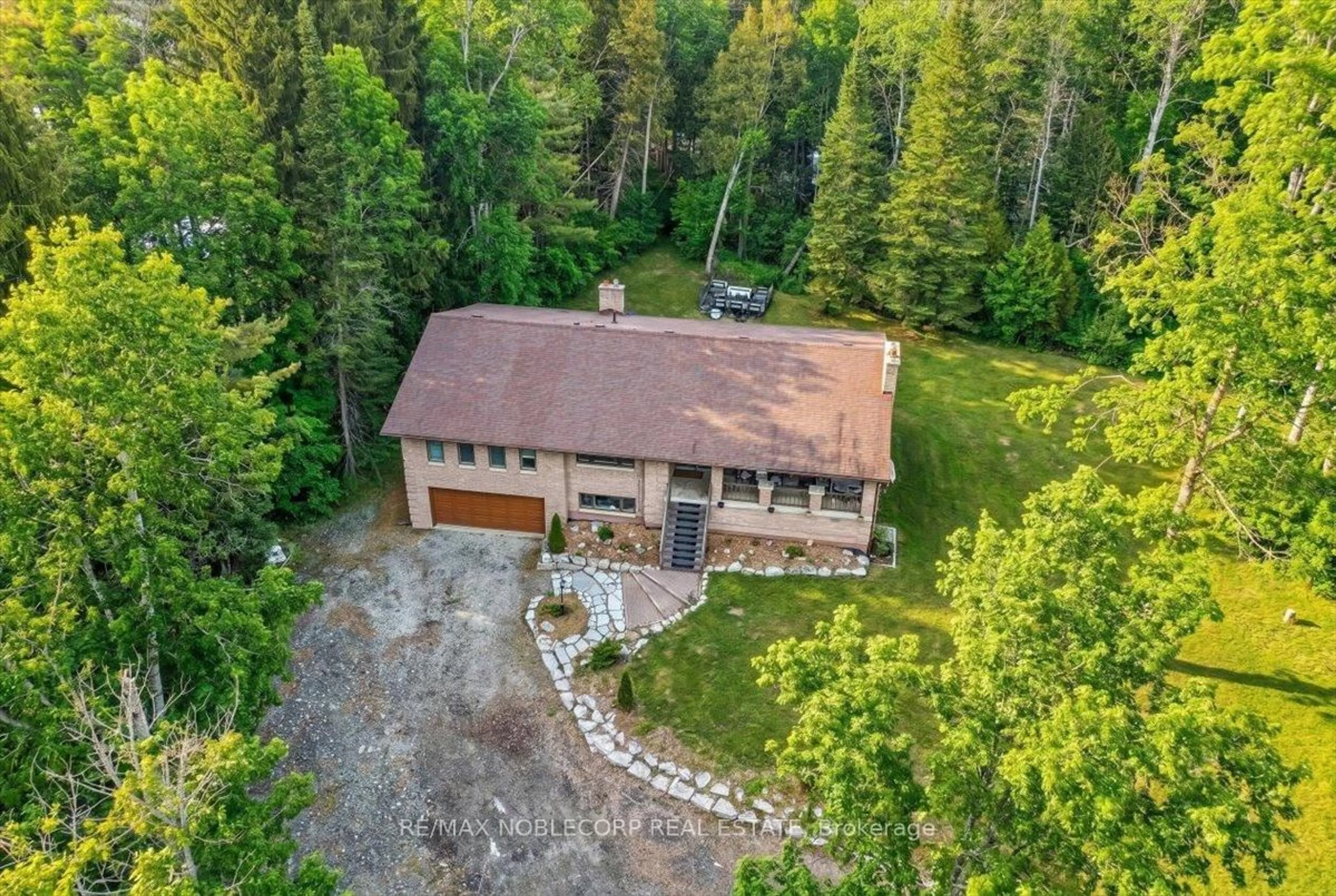A pic from outside/outdoor area/front of a property/back of a property/a pic from drone, forest/trees view for 1945 10th Sdrd, New Tecumseth Ontario L0G 1W0