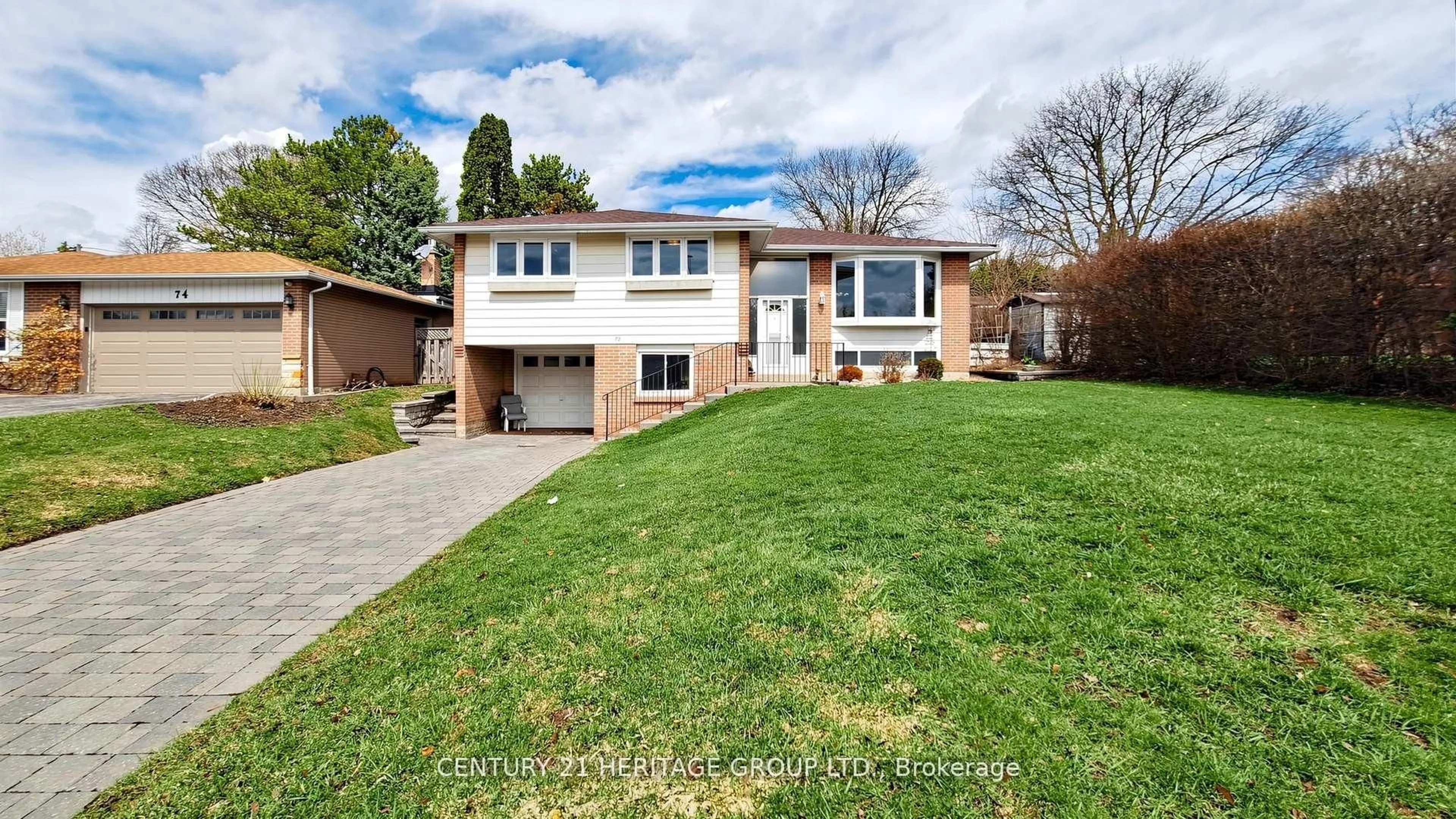 Home with brick exterior material, street for 72 Romfield Crct, Markham Ontario L3T 3H6