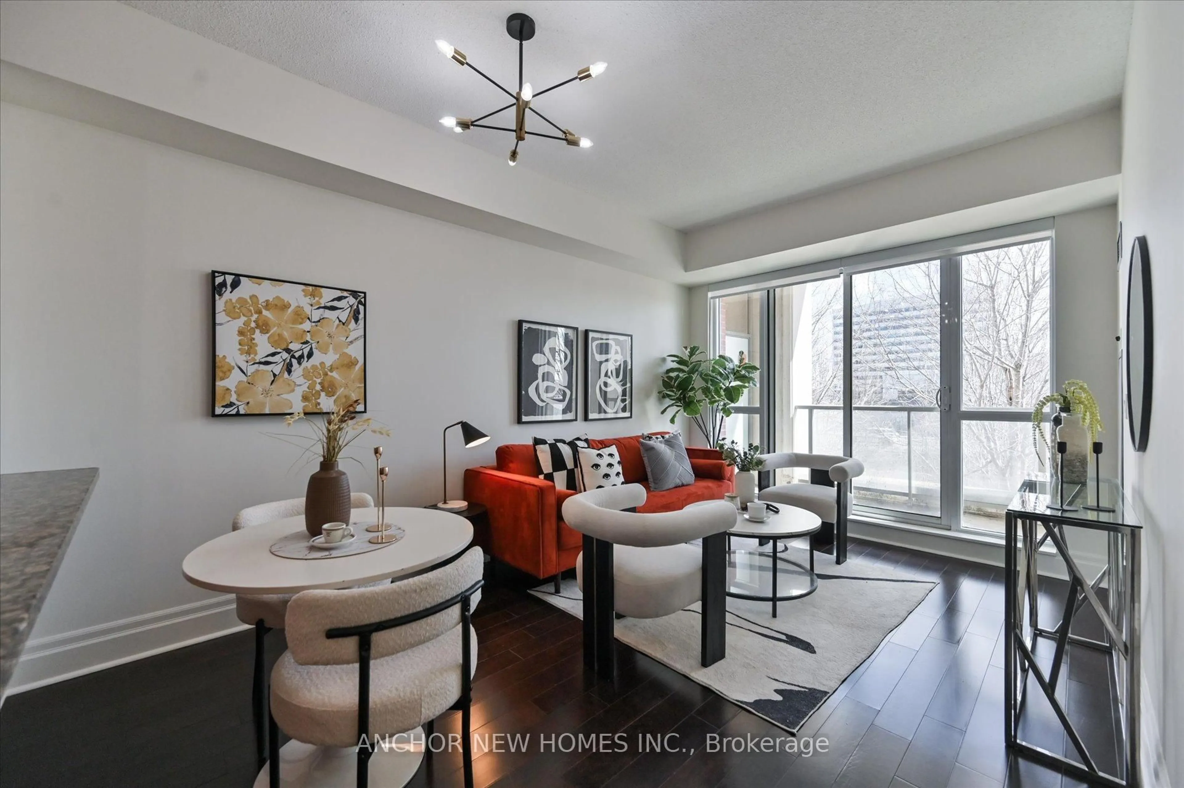 Living room with furniture, wood/laminate floor for 57 Upper Duke Cres #210, Markham Ontario L6G 0B9