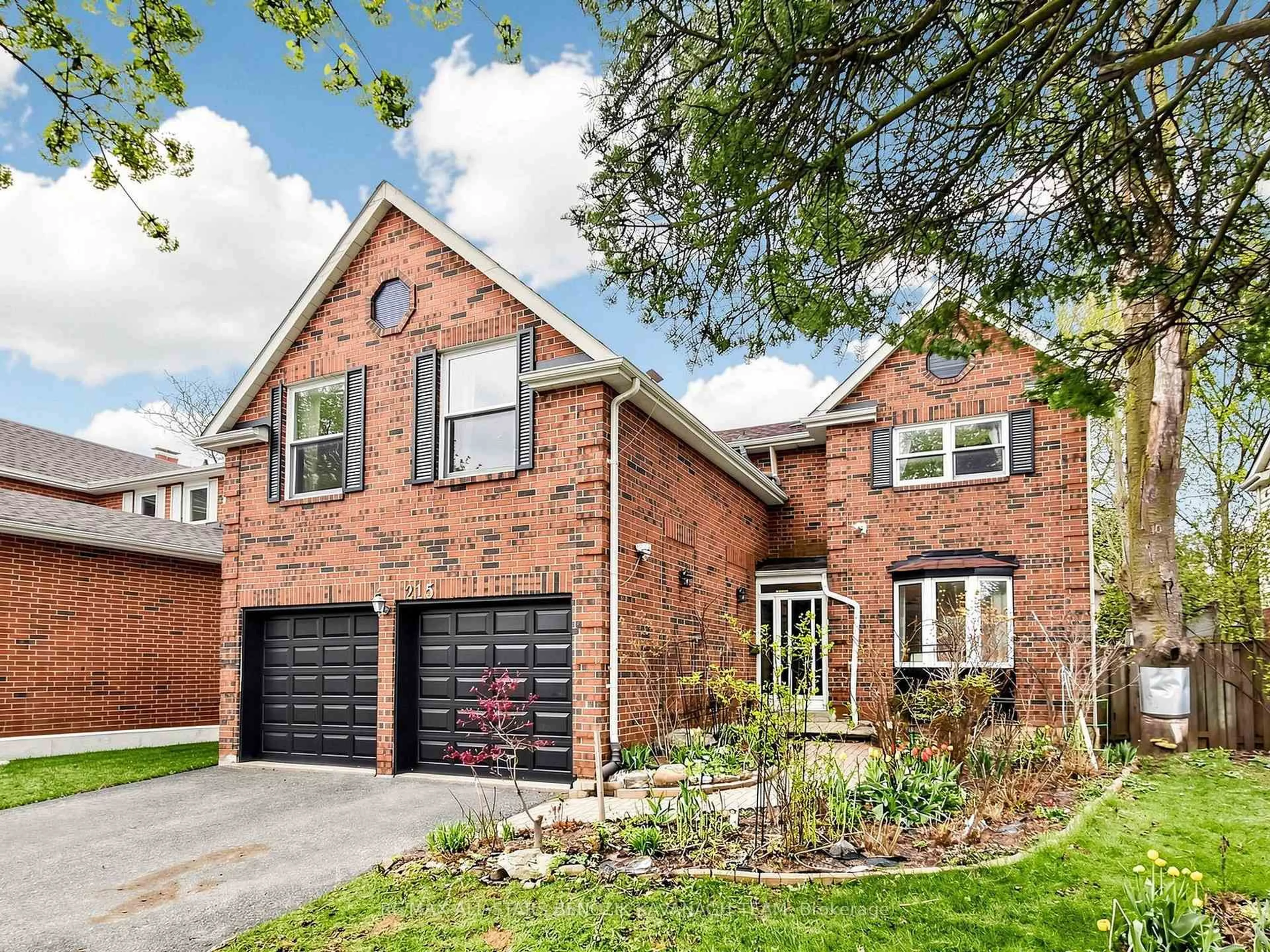 Home with brick exterior material, street for 215 Fincham Ave, Markham Ontario L3P 4B4