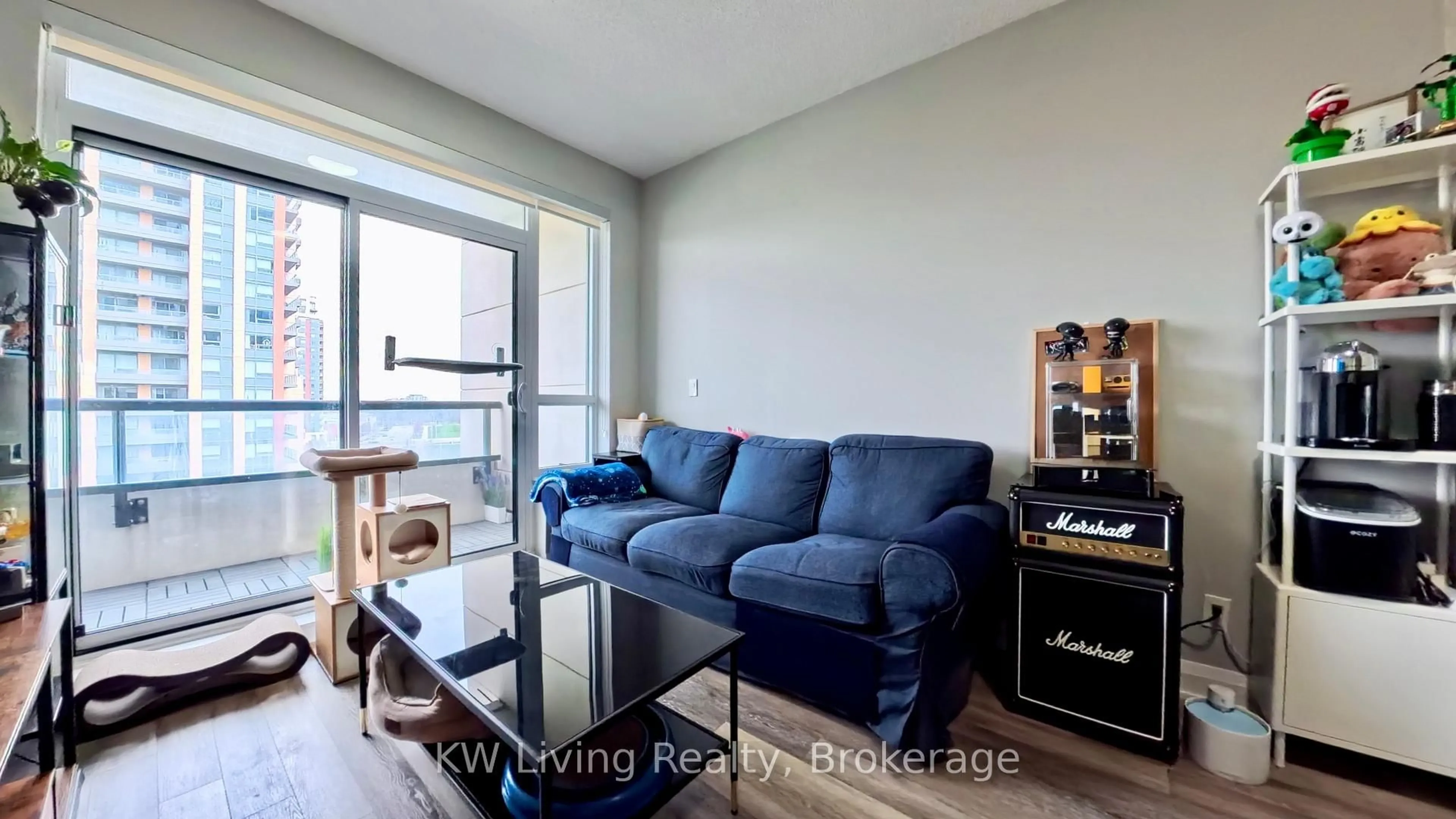 Living room with furniture, wood/laminate floor for 15 Water Walk Dr #711, Markham Ontario L6G 0G2