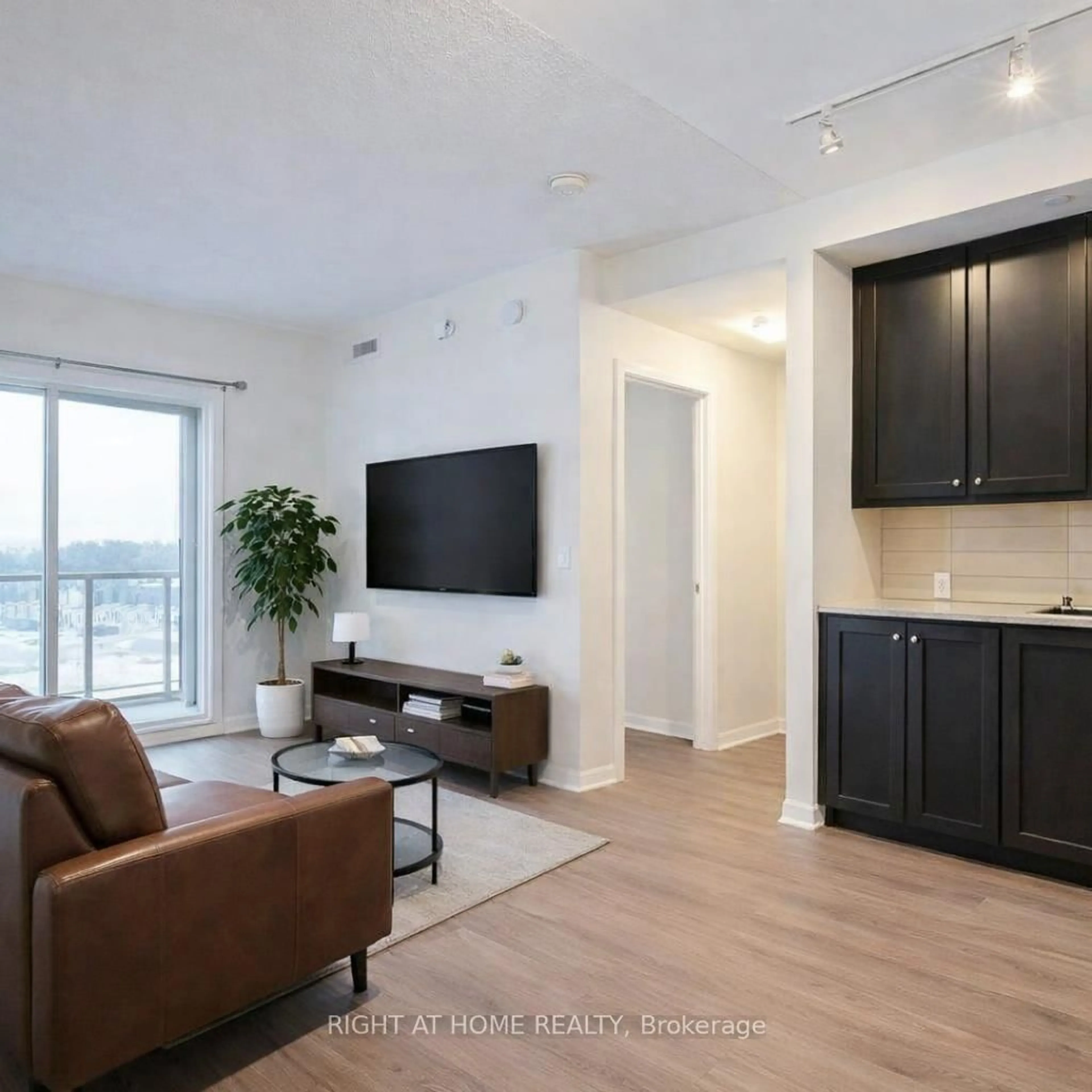 Living room with furniture, wood/laminate floor for 555 William Graham Dr #324, Aurora Ontario L4G 3H9