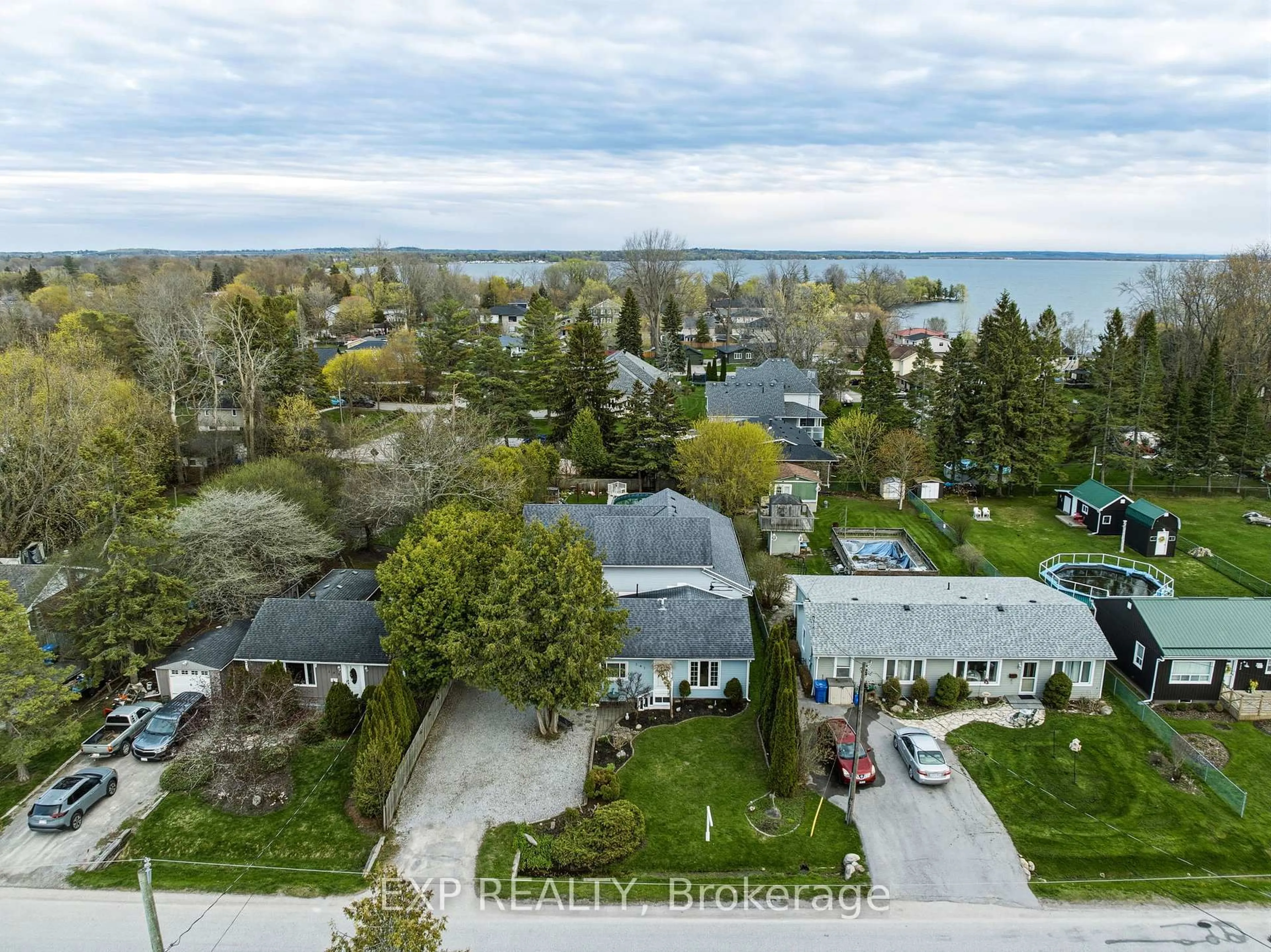A pic from outside/outdoor area/front of a property/back of a property/a pic from drone, water/lake/river/ocean view for 287 Elmview Gdns, Georgina Ontario L4P 1E9