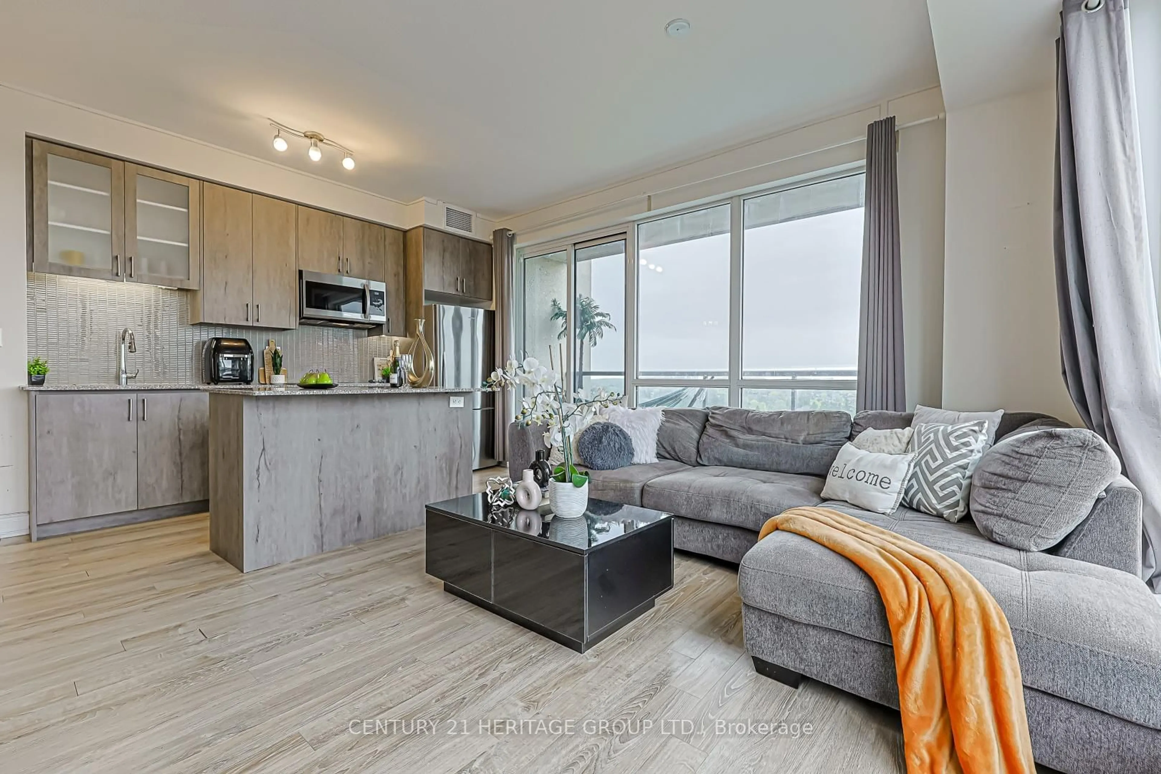 Living room with furniture, wood/laminate floor for 9090 Yonge St #1002, Richmond Hill Ontario L4C 6Z9